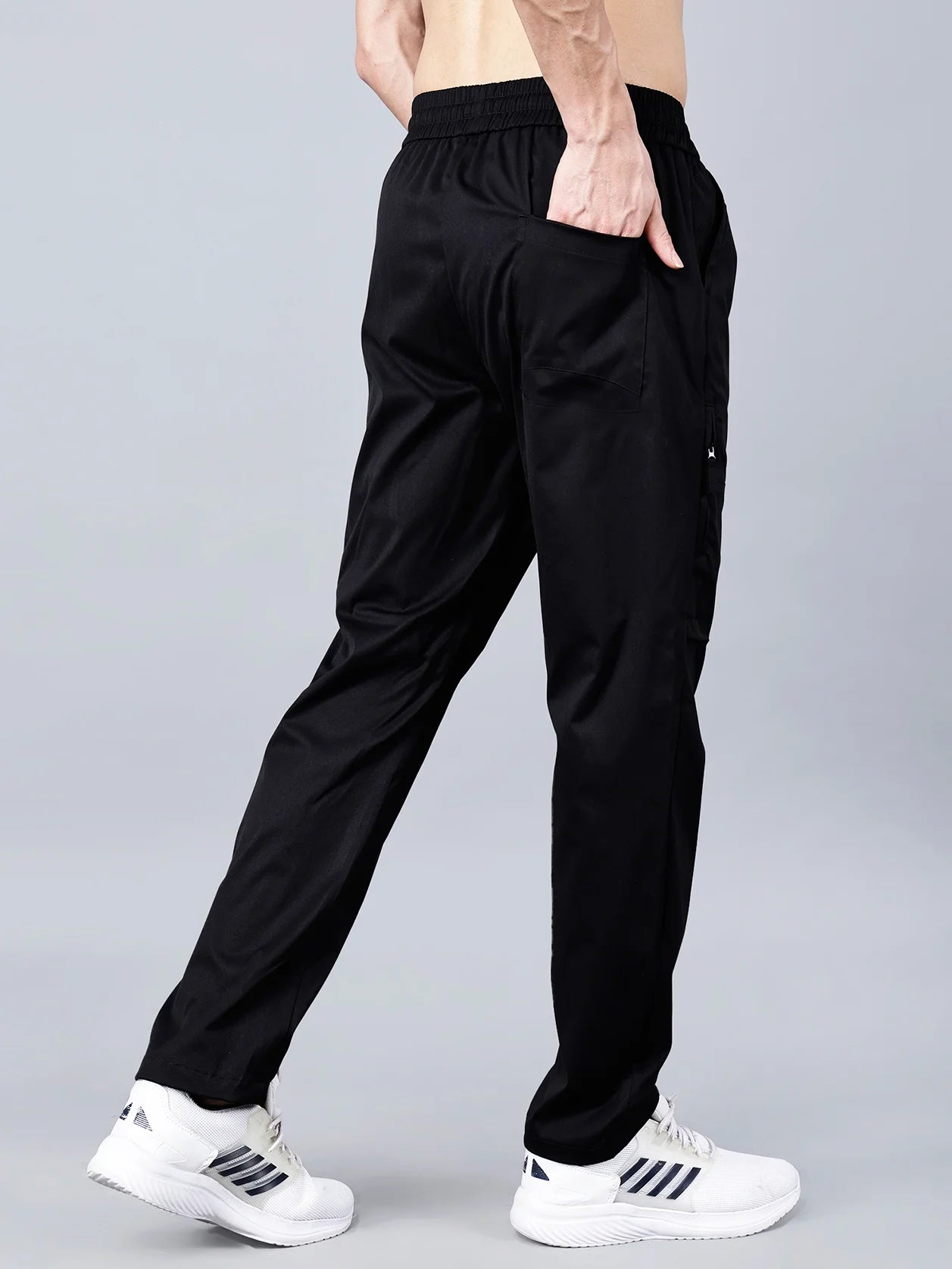 Discover the versatility and comfort of these breathable black cargo track pants for men from Fort Collins. Featuring a tapered fit, zippered pockets, and a stretchable cotton blend fabric, these stylish joggers are perfect for all-day wear whether you're at the gym, traveling, or just looking for casual comfort. Shop now from anywhere in India for the ultimate in comfort and utility.