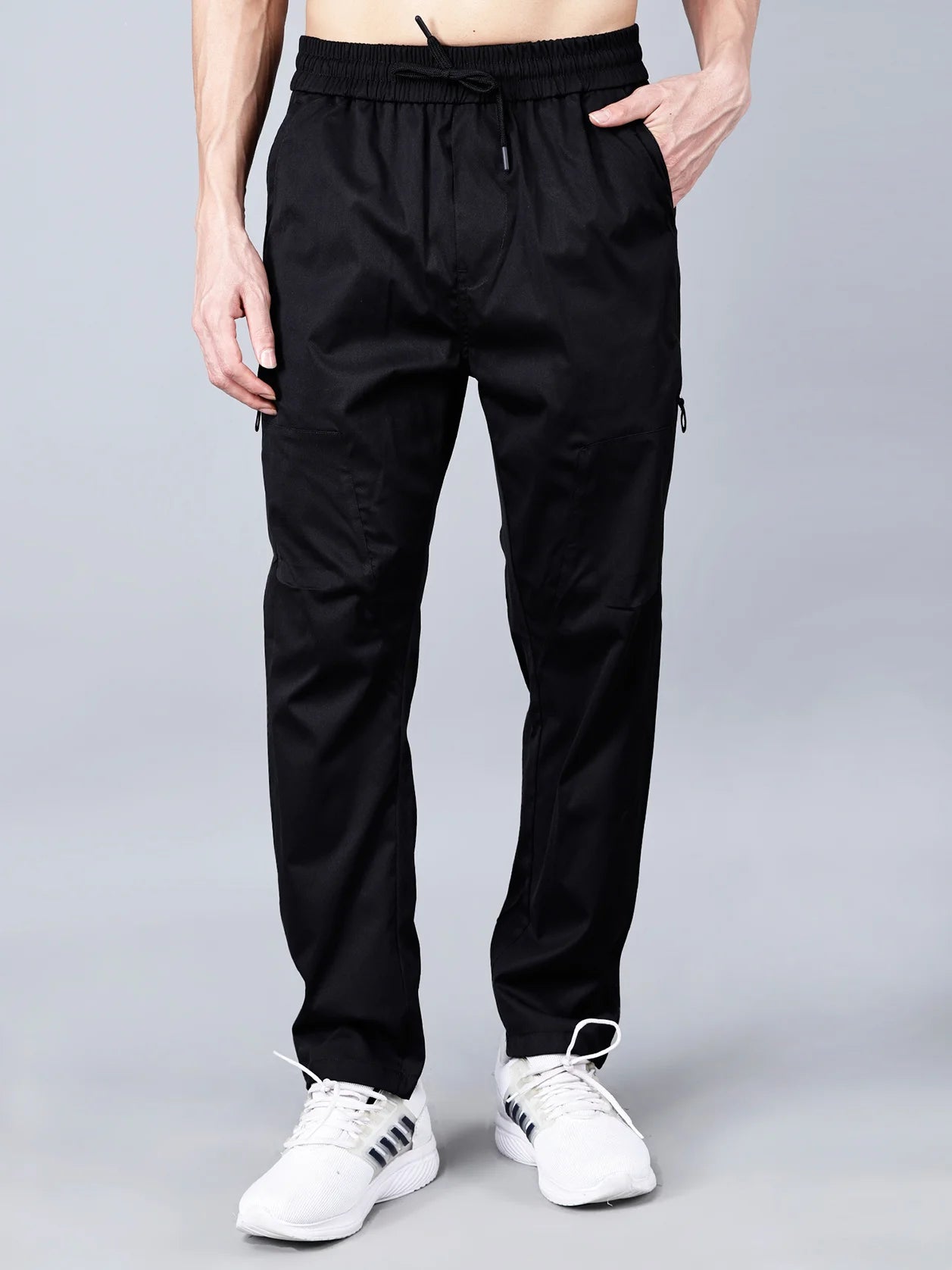 Shop online for Black Tapered Fit Cargo Track Pants for Men with Zippered Pocket, made with a highly breathable and stylish stretchable cotton blend fabric. Ideal for gym, travel, or casual wear, these joggers from Fort Collins provide all-day comfort and utility. Get yours now from anywhere in India.