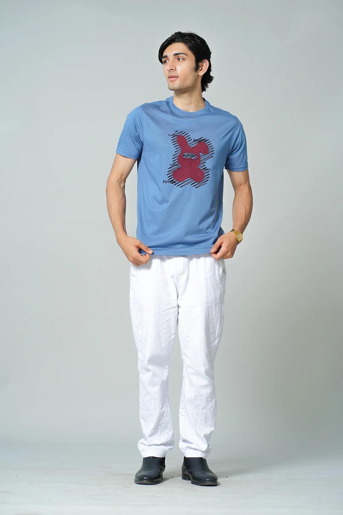 Upgrade your wardrobe with this Men's Blue Embroidered Graphic Print Round Neck T-Shirt by Fort Collins, available for purchase online from anywhere in India. Perfect for a fashionable yet comfortable look, shop now and elevate your style game.
