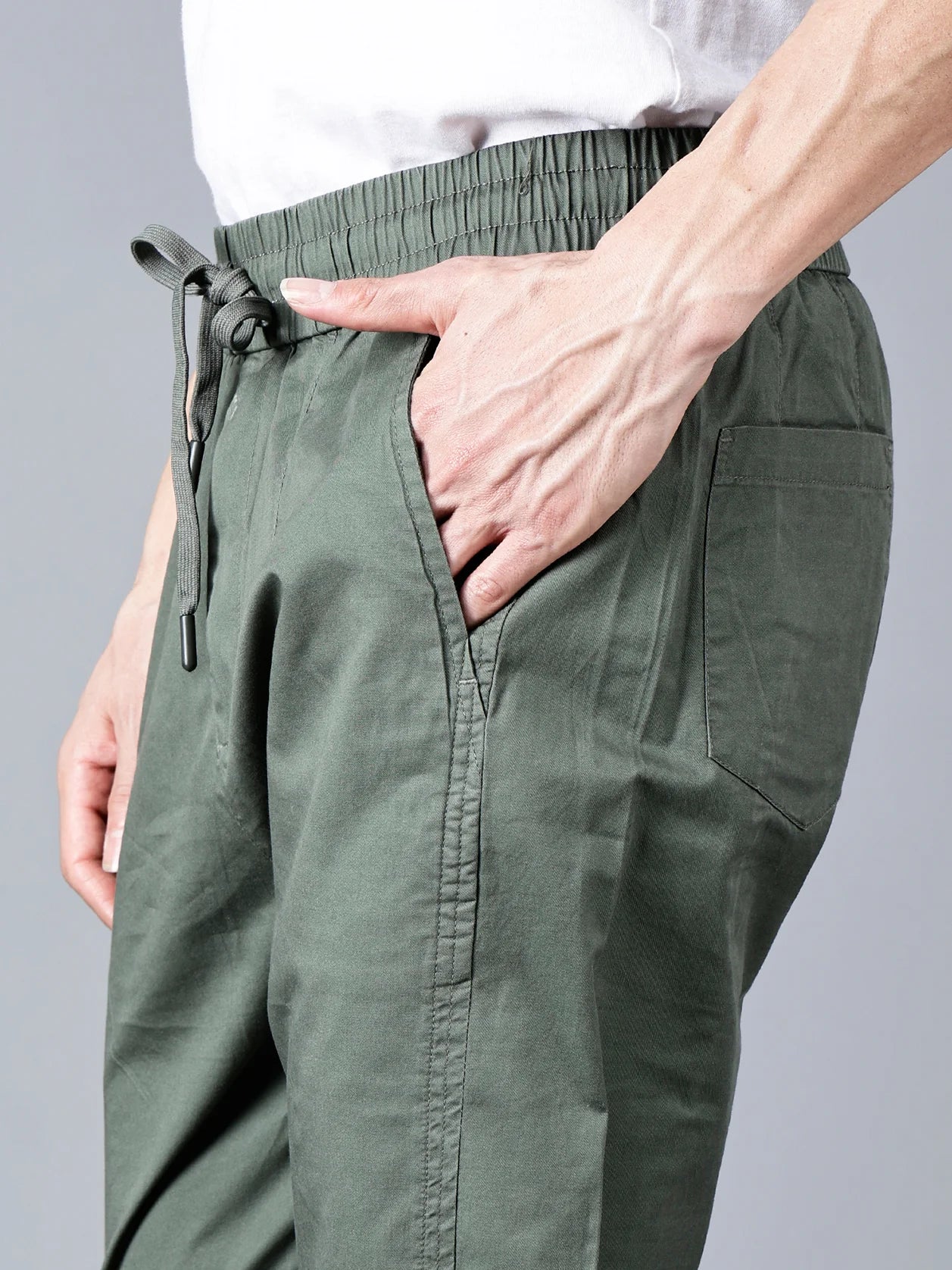 Discover the stylish and comfortable Green Cotton Track Pants for Men by Fort Collins. Featuring a smart taper fit, elastic waistband, and drawstring closure, these pants offer both versatility and function. The multi-pocket design makes them perfect for casual everyday wear. Shop now for a trendy track pant in India, available online.