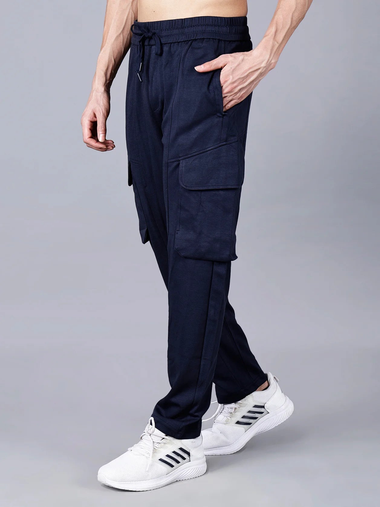 Shop now for Fort Collins Cargo Track Pant of Men in Navy Blue color with Utility Pockets, featuring an elastic waistband, cargo flap pockets, and a structured cotton-polyester fabric for all-day comfort and streetwear-ready style. Available for purchase online from anywhere in India.