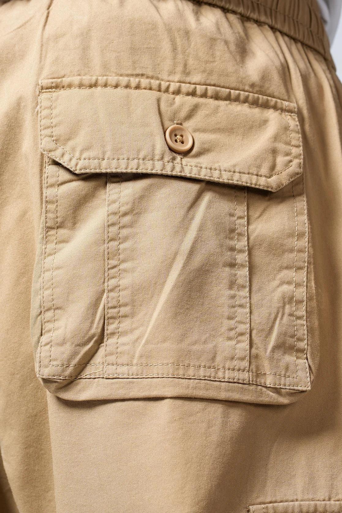 Discover the supreme comfort and versatility of the Men's Beige Smart Fit Track Pant with Multiple Pockets, available online in India through Fort Collins.
