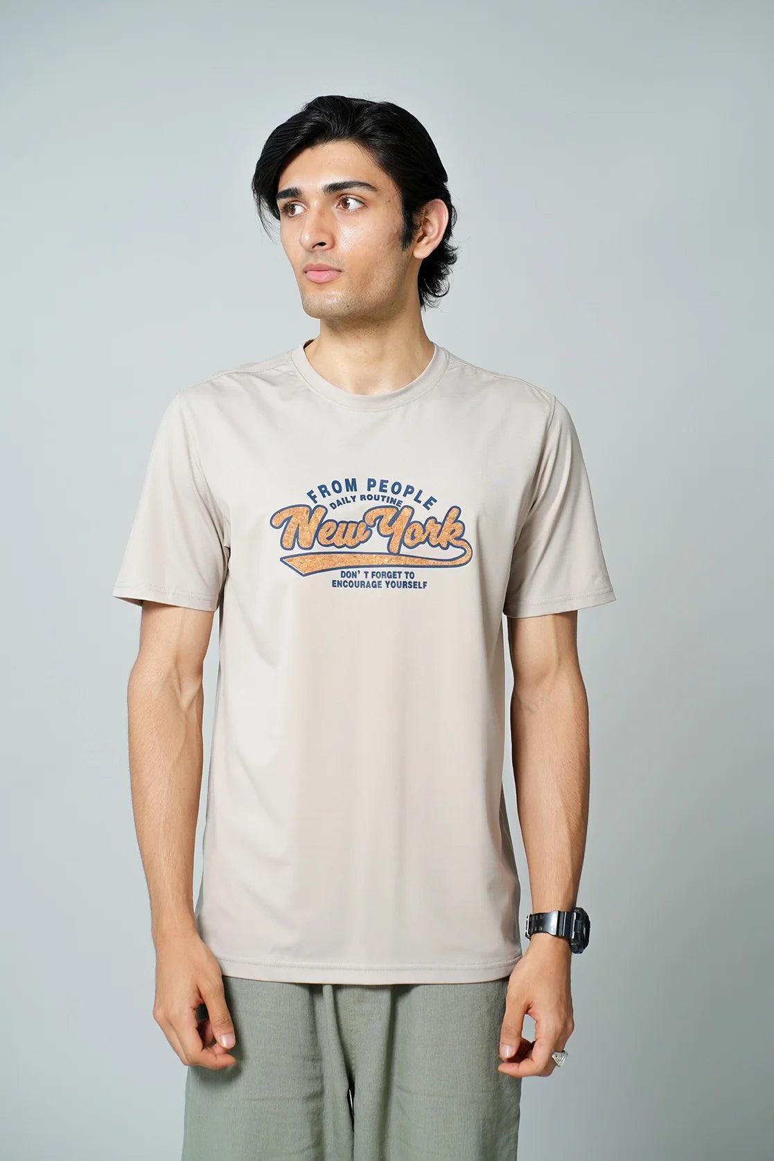 Shop for a trendy wardrobe upgrade with Fort Collins Men's Beige Stretchable T-Shirt featuring a New York graphic print. Buy now for easy online access from anywhere in India.