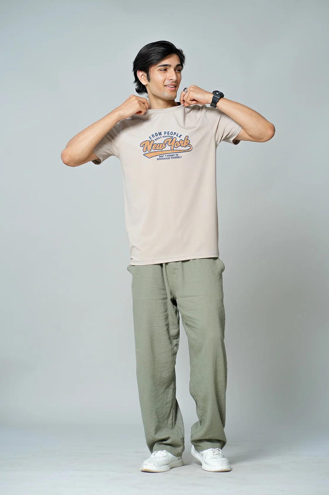 Upgrade your wardrobe with the Fort Collins Men's Beige Stretchable T-Shirt featuring a stylish New York graphic print. Available for online purchase from anywhere in India.