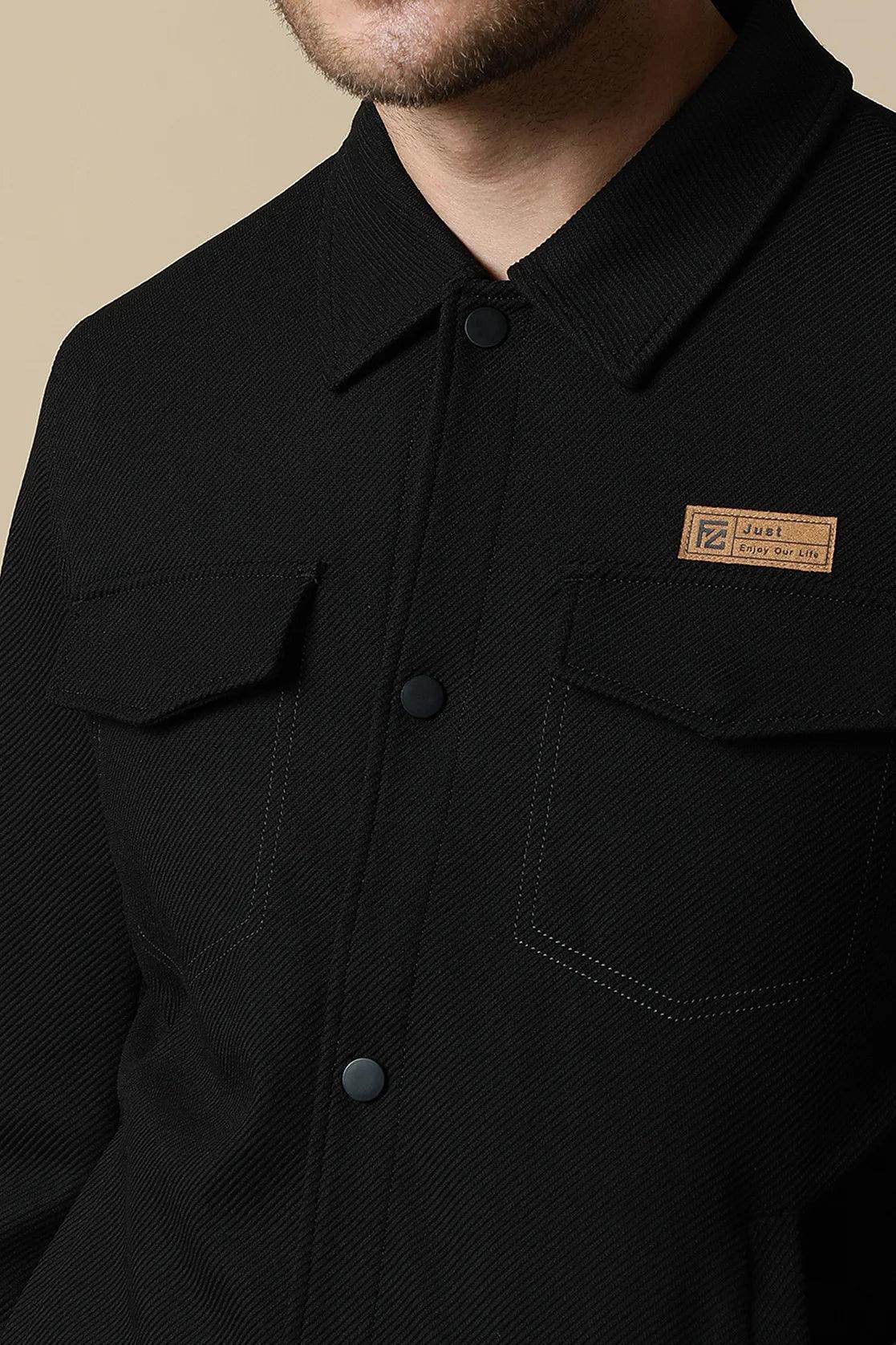 Upgrade your wardrobe with the Fort Collins Men's Black Button-Up Knitted Jacket. This trendy piece is available online for easy access from anywhere in India.
