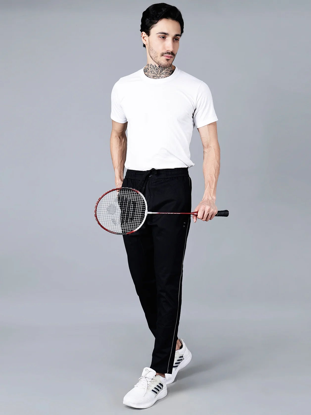 Discover the versatility and comfort of Fort Collins Men's Black Slim Fit Track Pants with Side Stripe. Perfect for both casual and active wear, these stylish joggers are made with stretchable fabric for a comfortable fit. Shop now online from anywhere in India.