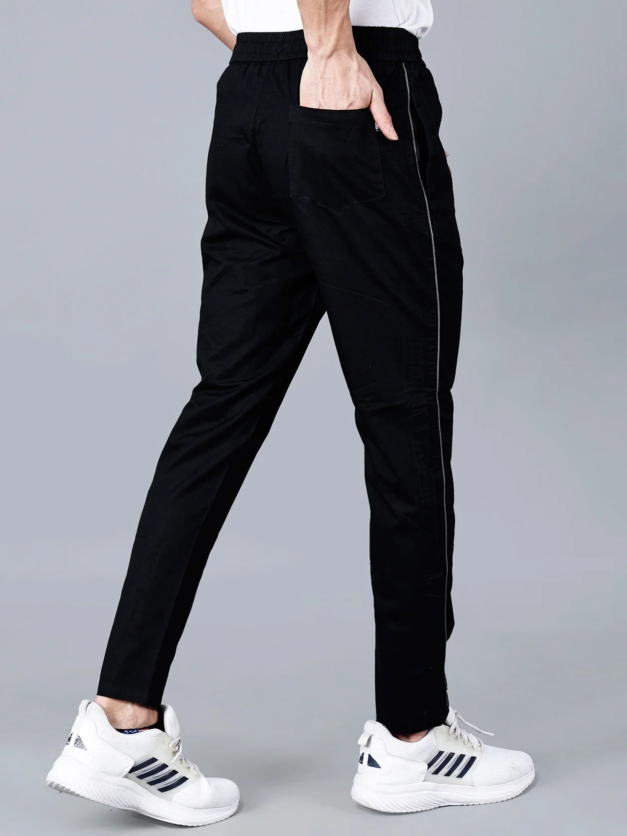 Discover the comfort and style of Fort Collins's black slim fit track pants with a side stripe. Perfect for casual wear or physical activity, these stretchable joggers are available now for purchase online in India.