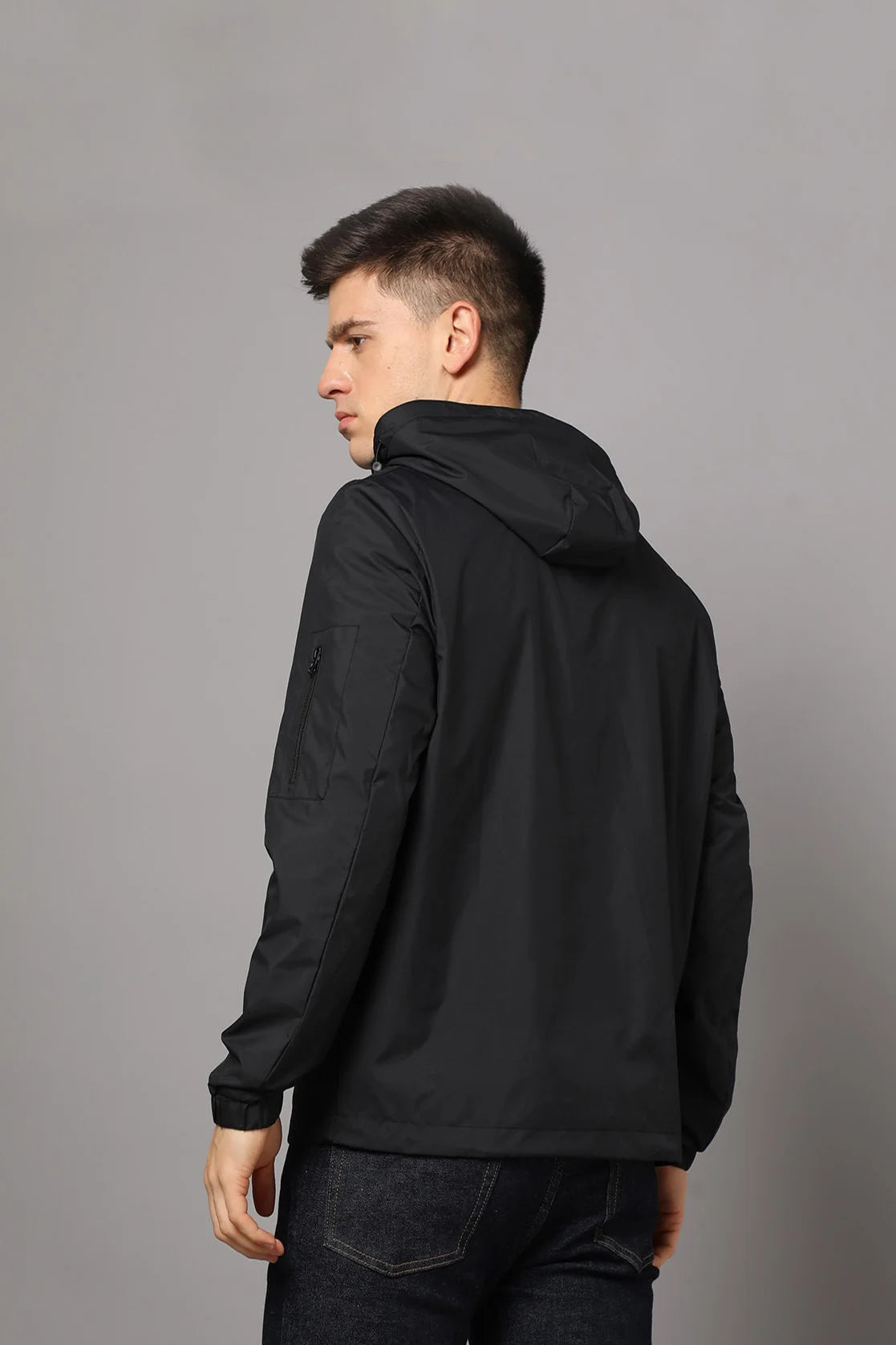 Experience the ultimate men's black windbreaker jacket with adjustable hood and mesh-net lining. Shop now for a stylish wardrobe upgrade, available online for all men in India.