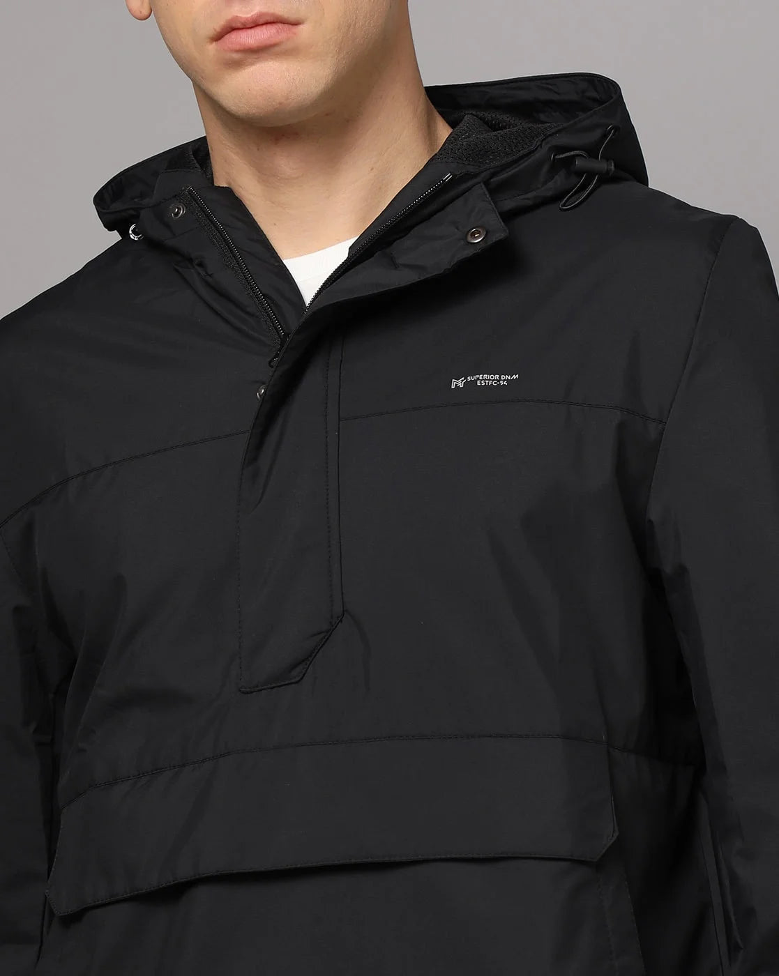 Discover the sleek and versatile Fort Collins Men's Black Windbreaker Jacket with Adjustable Hood and Mesh-net Lining, available for online purchase throughout India. Keep up with the latest fashion trends while staying comfortable and protected from the elements.