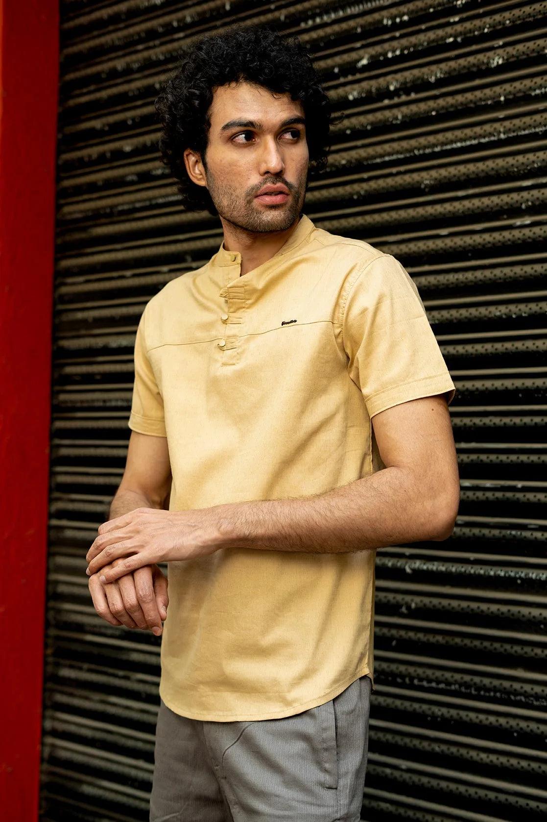 Introducing the Men's Casual Beige Mandarin Collar Shirt Kurta by Fort Collins. The perfect combination of style and comfort for any occasion. Upgrade your wardrobe with this essential piece for the modern man.