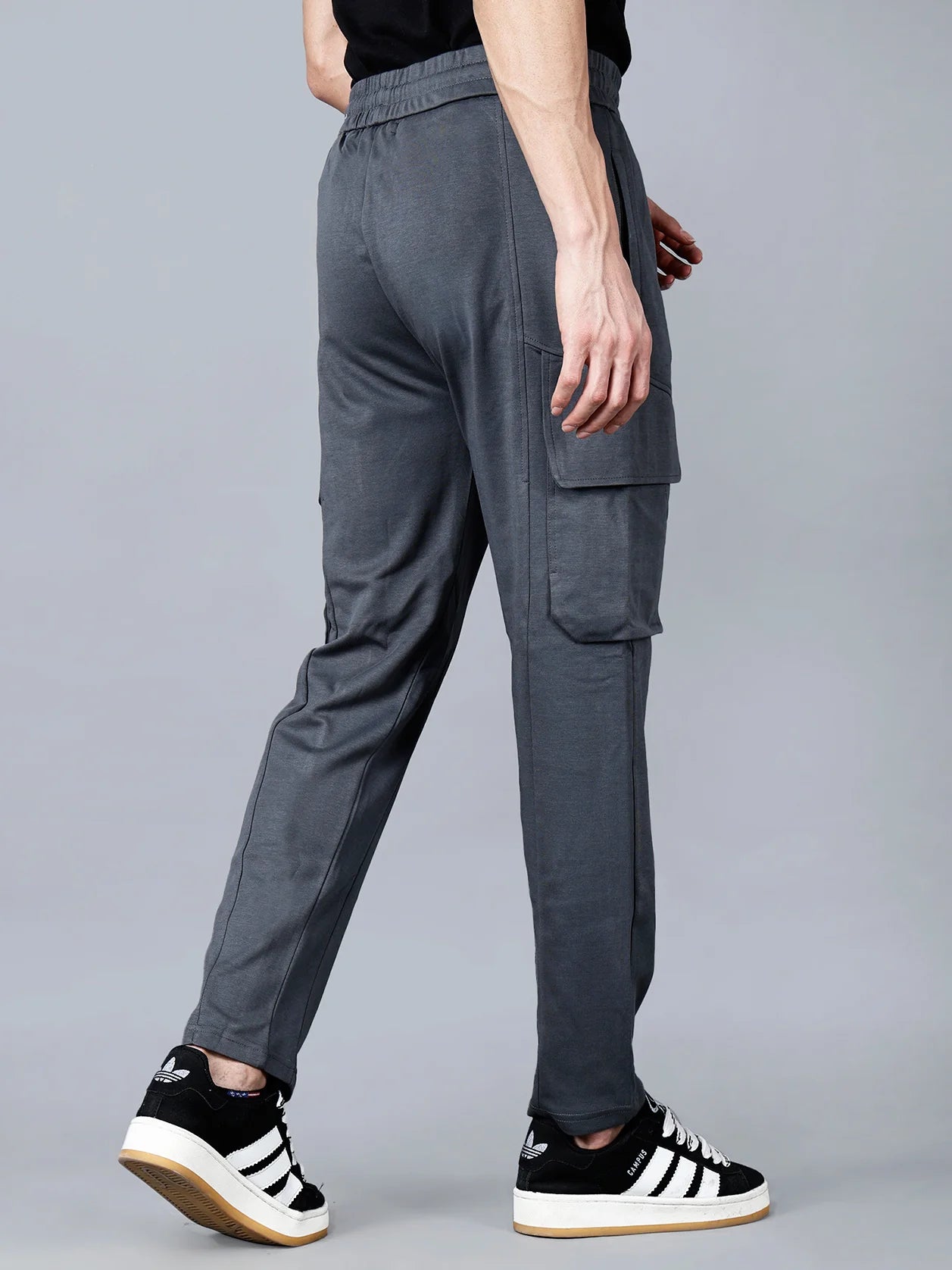 Discover the ultimate comfort and style with Fort Collins Men's Charcoal Grey Cargo Track Pant. Featuring elastic waistband and structured cotton-polyester fabric, these pants are perfect for everyday wear and will give a streetwear-ready touch to your look. Shop online now from anywhere in India.