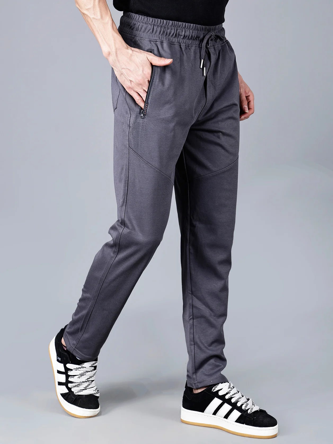 Explore the sleek and stylish Men's Charcoal Grey Structured Track Pant with Zipper Pockets. Available for convenient online shopping in India.