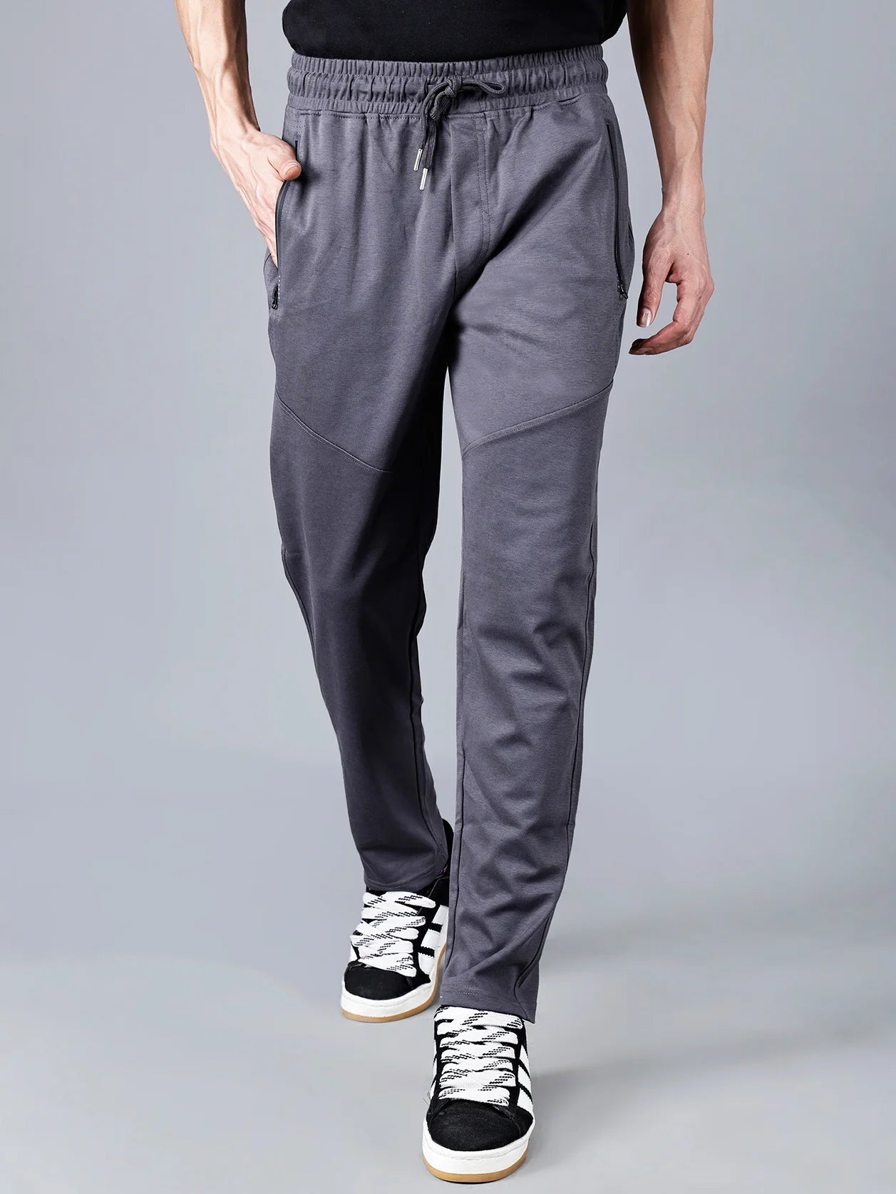 Shop online now for the latest addition to your wardrobe, the Men's Charcoal Grey Structured Track Pant with Zipper Pockets, available for purchase across India. Experience the convenience of shopping from anywhere with this stylish and practical garment.