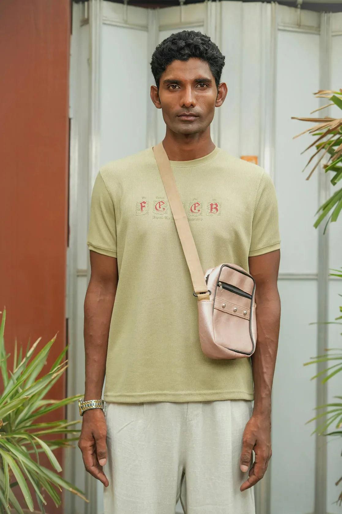 This Men's Light Green Embossed Print Round Neck Short Sleeve T-Shirt from Fort Collins is a stylish and comfortable choice, available for online sale in India.