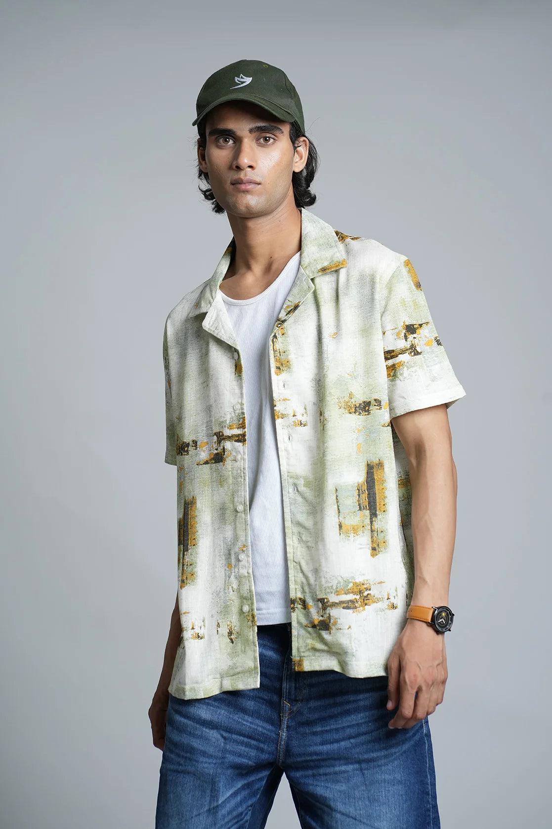 Shop now for a stylish wardrobe upgrade from anywhere in India with this Men's Green abstract Print Open Collar Casual Shirt by fort collins. Perfect for adding a touch of sophistication to your wardrobe, this shirt is designed with an eye-catching abstract print and an open collar for a casual yet polished look. Don't miss out on this must-have addition to your collection.