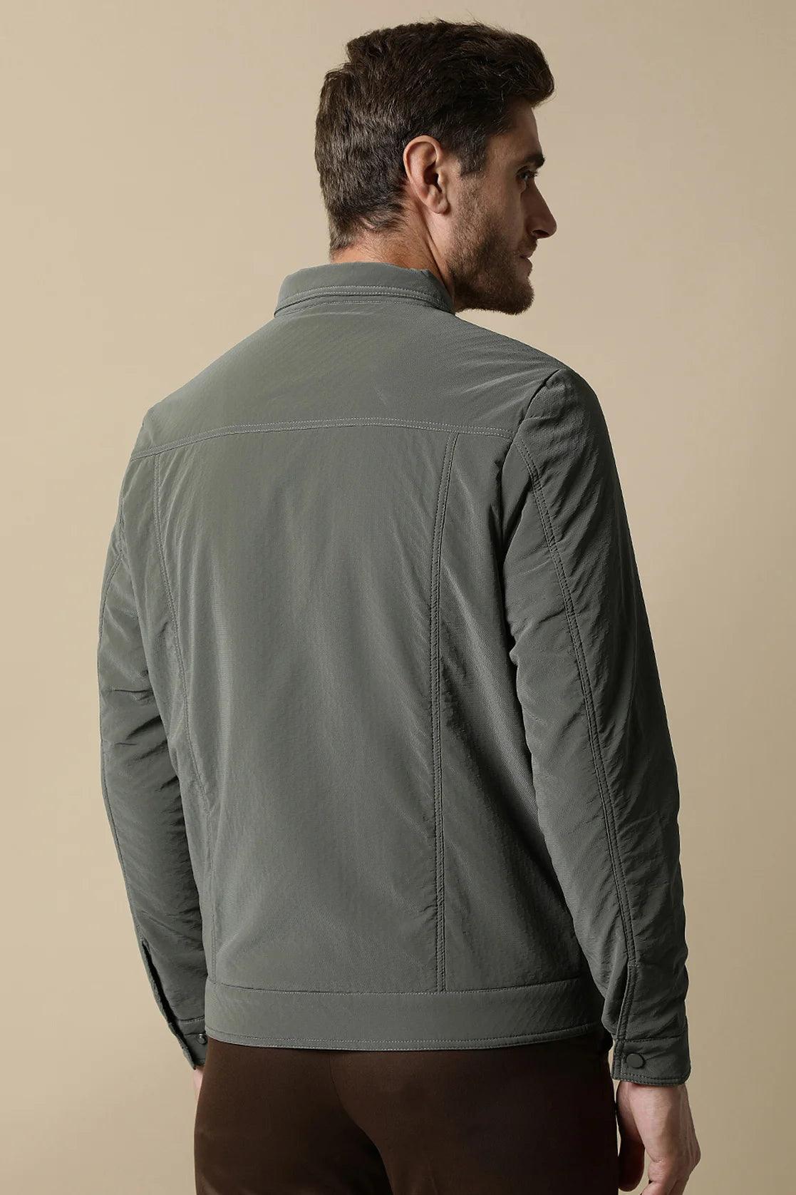 Experience a stylish upgrade to your wardrobe with the Fort Collins Men's Grey PU Coated Jacket, featuring a classic front zip. Shop now for this trendy item from anywhere in India.