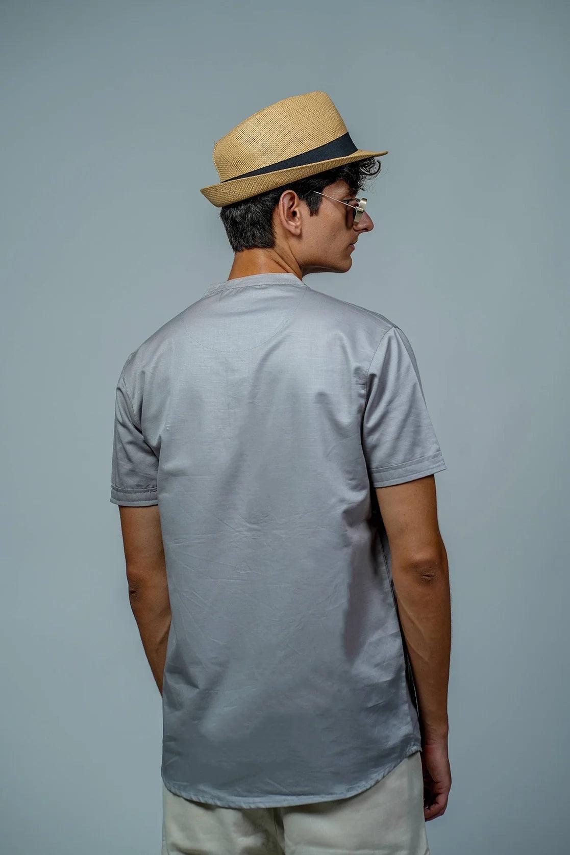 This Men's Grey Relaxed Fit Mandarin Collar T-Shirt Kurta by Fort Collins features a convenient chest pocket and a relaxed fit for a comfortable and stylish look.