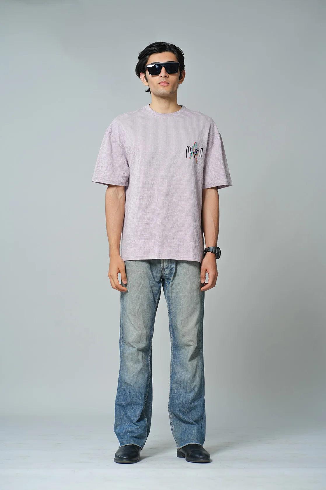 Upgrade your wardrobe with the Men's Lavender Structured Cotton-Lycra Oversized T-Shirt by Fort Collins. Shop now and elevate your style with this on-trend piece, available for purchase from anywhere in India.