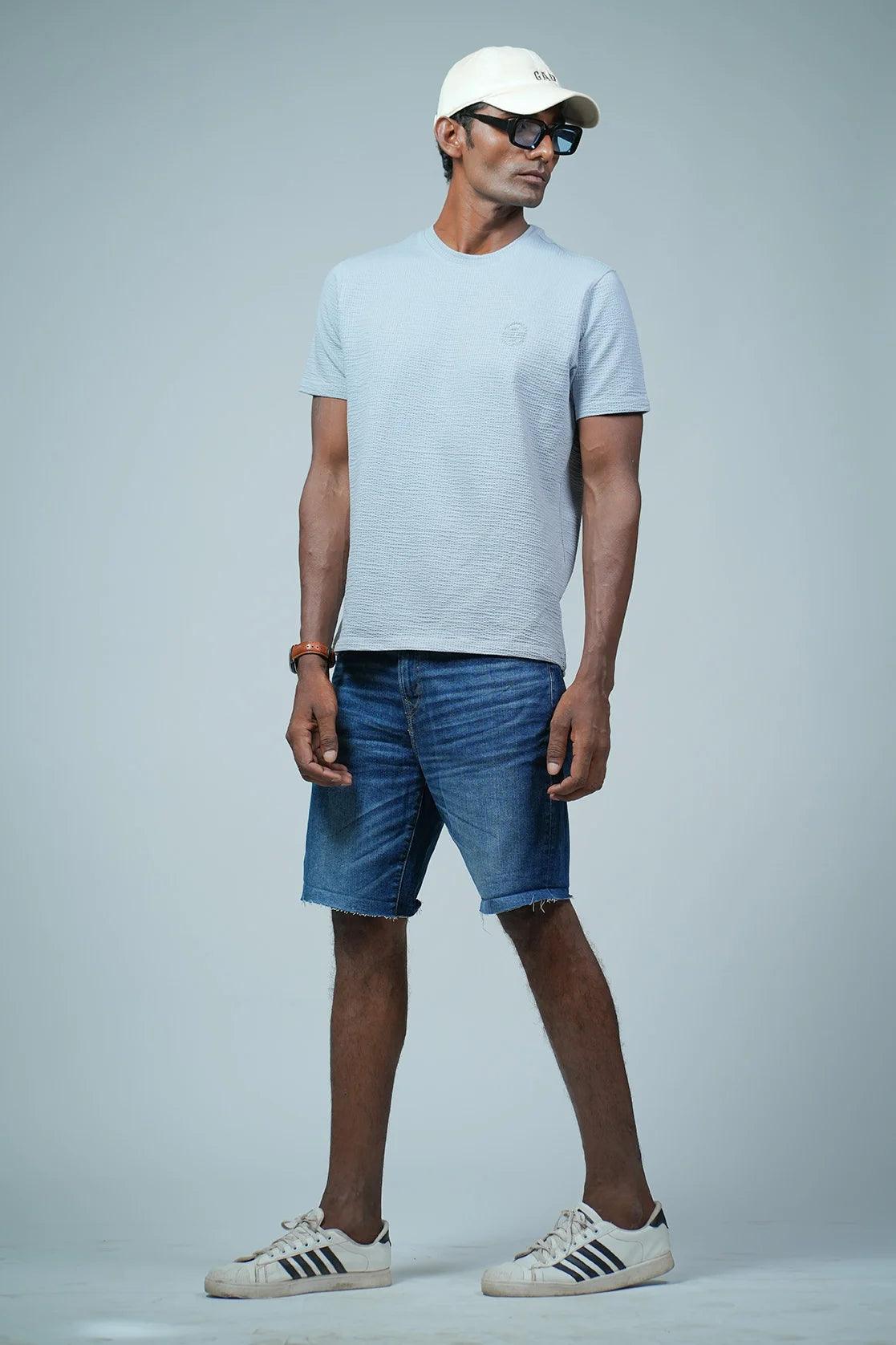 Upgrade your wardrobe with this Men's Light Blue Structured Cotton-Lycra T-Shirt featuring a Chest Logo from Fort Collins. Shop now for a stylish and trendy look across India.