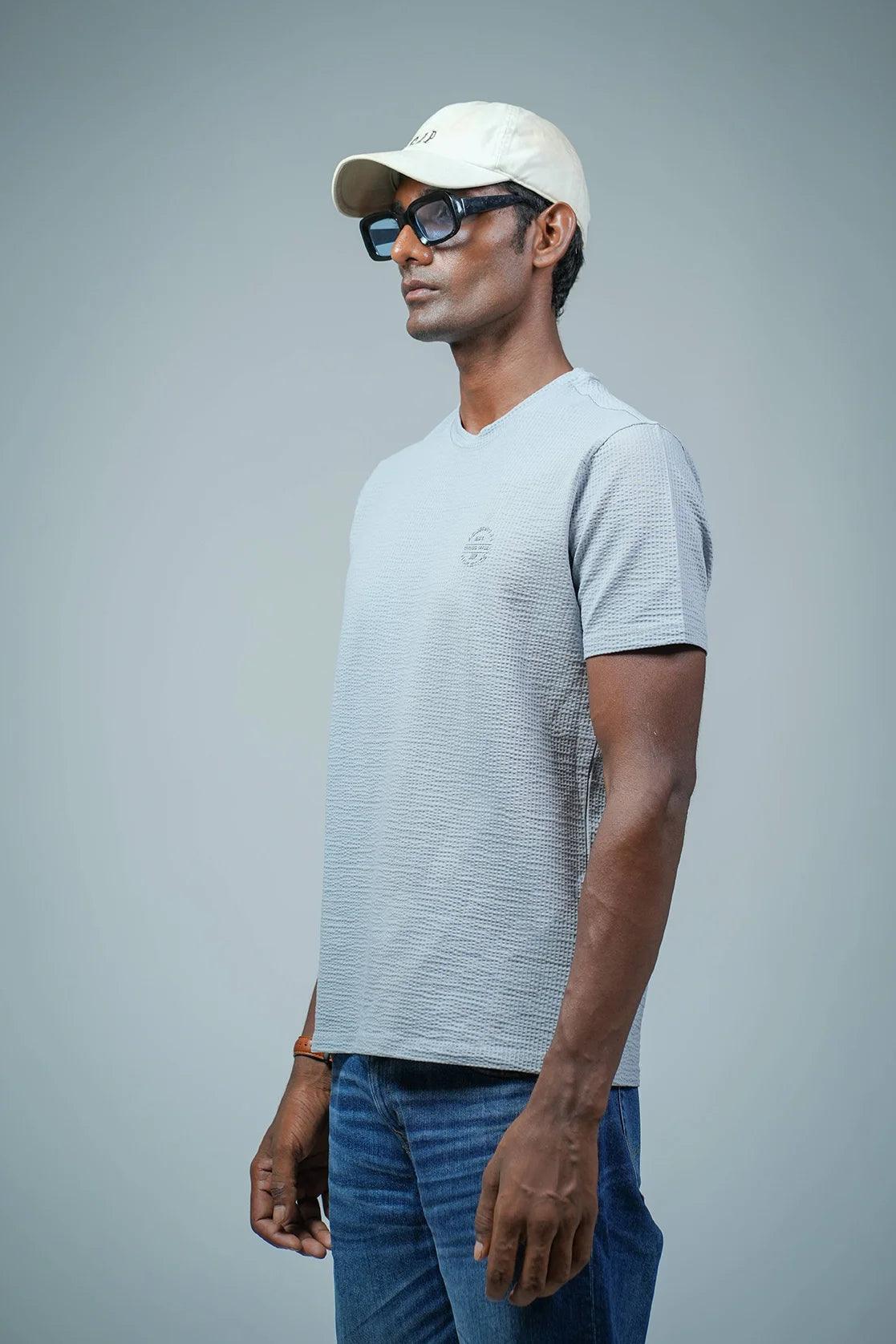 Men's Light Blue Structured Cotton-Lycra T-Shirt with Chest Logo from Fort Collins - available for online purchase in India. Elevate your wardrobe with this stylish option.