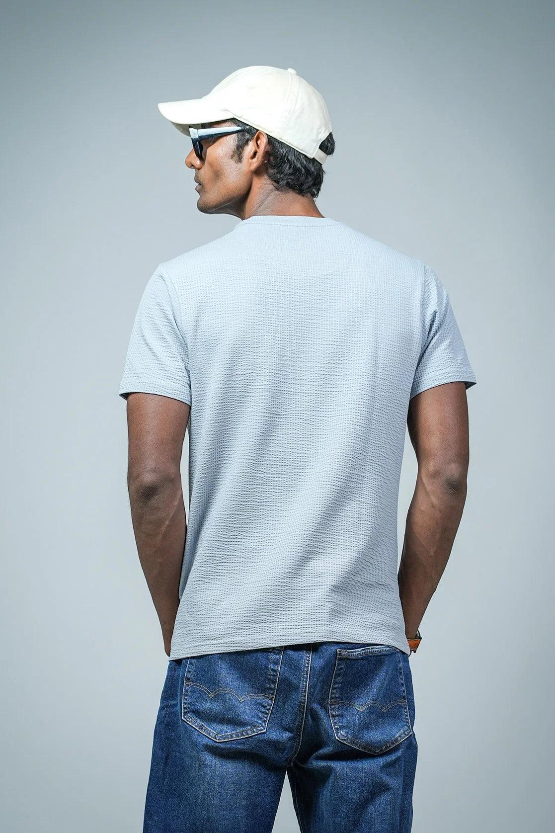 Upgrade your wardrobe with this Men's Light Blue Structured Cotton-Lycra T-Shirt featuring a Chest Logo from Fort Collins. Available for purchase online in India.