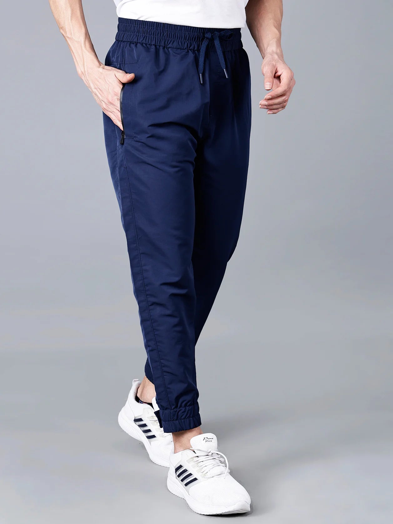 Discover Fort Collins men's navy blue track pants with zippered pockets and adjustable hem—perfect blend of sporty style and everyday comfort. Buy online from anywhere in India.