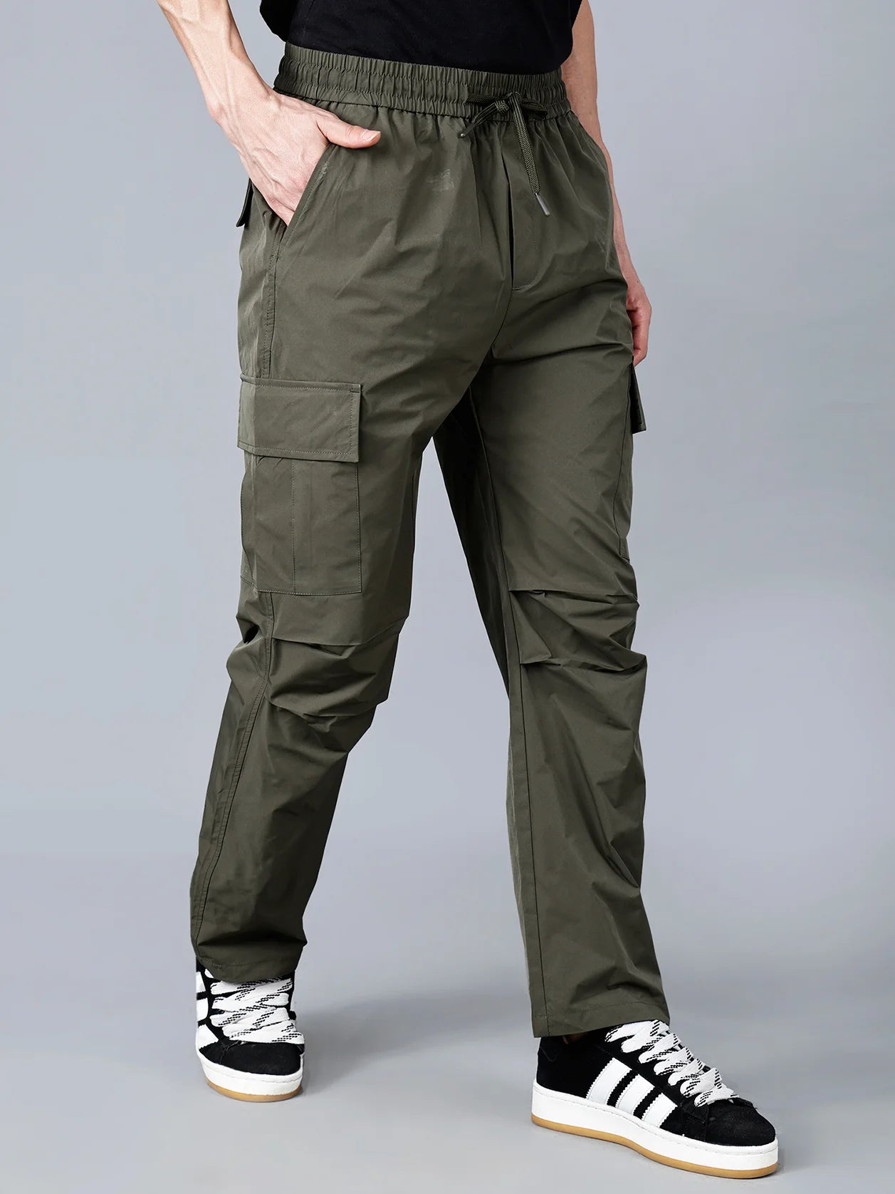 Fort Collins olive green cargo track pant for men with utility pockets – stylish, durable, and perfect for outdoor and casual looks. Shop now online for a trendy wardrobe from anywhere in India.