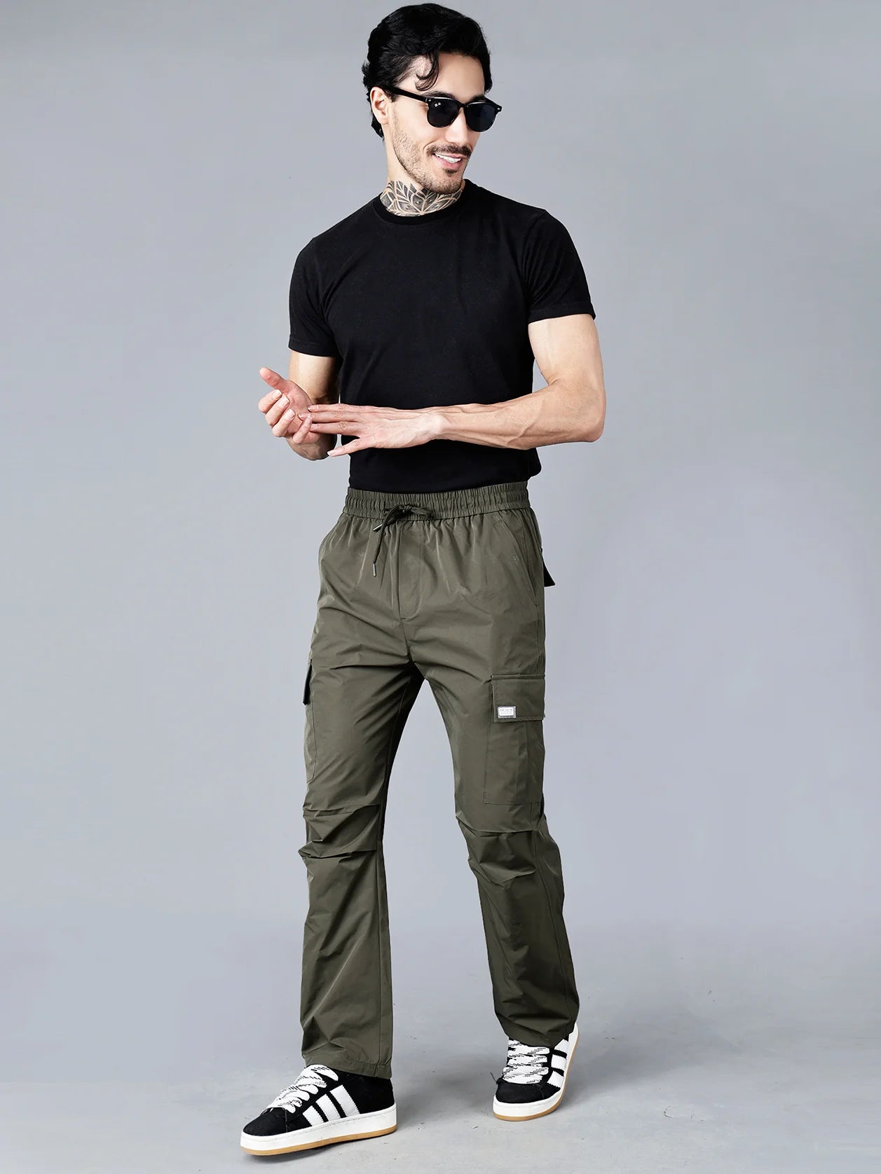 Shop now for Fort Collins Men's Olive Green Relaxed Fit Cargo Track Pants with Utility Pockets - a versatile and durable option for both outdoor and casual wear, available online from anywhere in India.