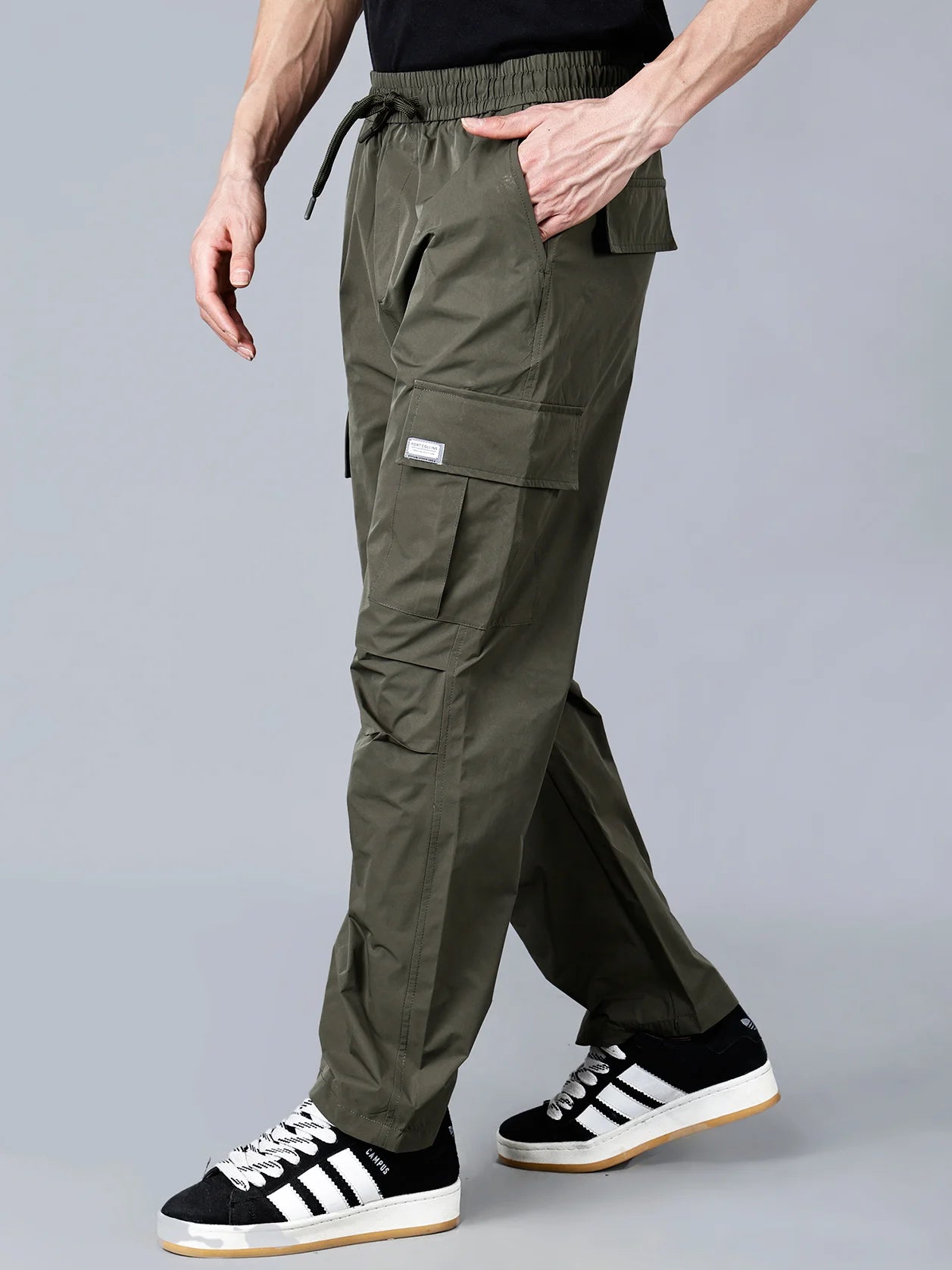 Discover the versatility of the Men's Olive Green Relaxed Fit Cargo Track Pant, designed with multi-pocket utility and durable materials for outdoor and casual wear. Shop now for a trendy wardrobe, available online in India.