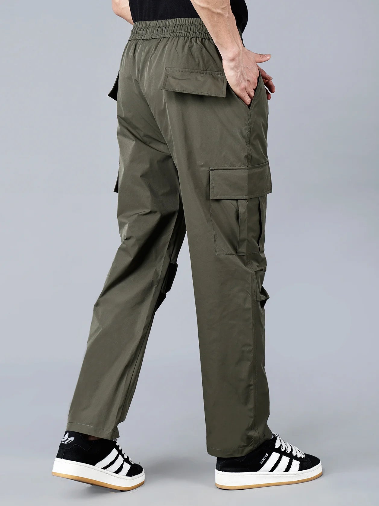 Discover the versatility of Men's Olive Green Relaxed Fit Cargo Track Pant with Multi-Pocket Utility Style. Perfect for any occasion, these durable and stylish pants are a must-have for any wardrobe. Available online in India.
