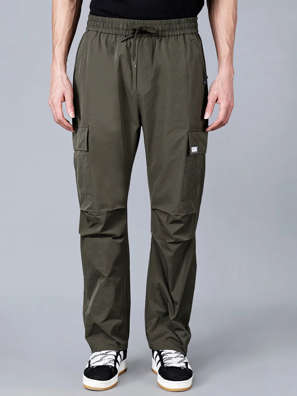 Discover the versatility and reliability of Fort Collins Men's Olive Green Cargo Track Pant, complete with utilitarian pockets. Perfect for both rugged outdoor activities and casual everyday wear. Get your hands on this must-have wardrobe essential now, conveniently available for online purchase from anywhere in India.
