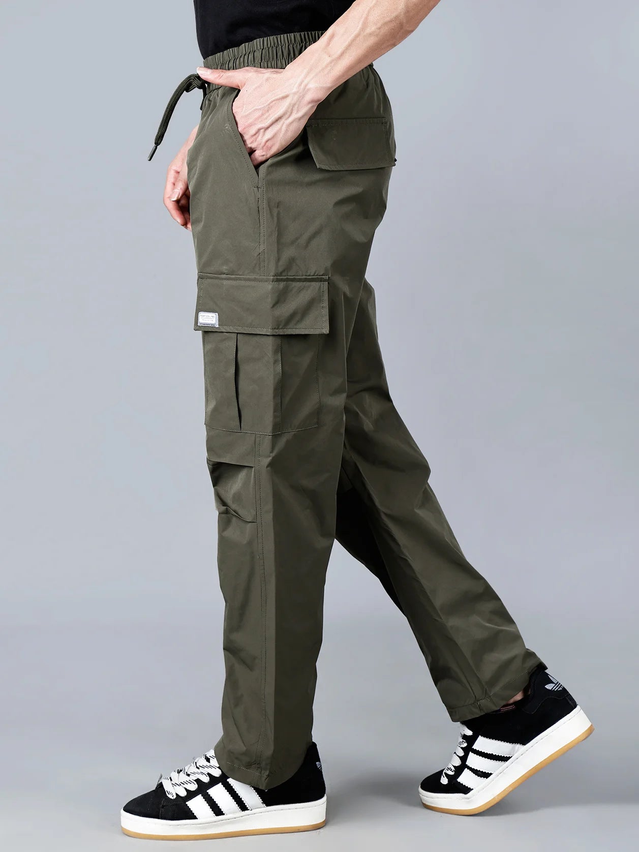 Discover the ultimate utility and style with the Fort Collins olive green cargo track pant for men. Perfect for outdoor and casual wear, these pants feature multi-pocket design for convenience and durability. Buy now online from anywhere in India for a fashionable wardrobe upgrade.