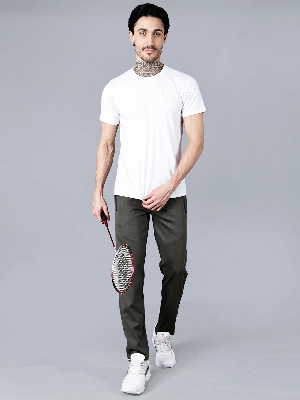 Discover the perfect combination of comfort and style with our Men's Olive Green Structured Track Pant. Featuring a slim-tapered fit, articulated knee panels, and zipper pockets, this cotton-polyester knit fabric pant is a must-have for any modern man. Shop now from anywhere in India.