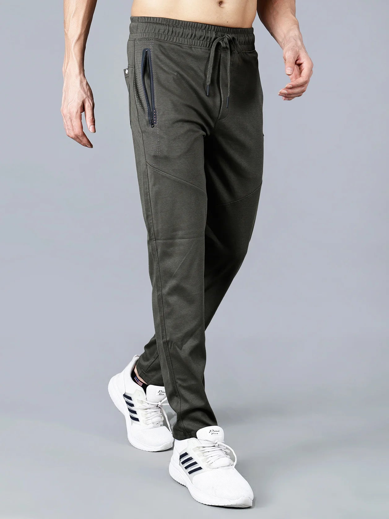 Experience the ultimate in comfort and style with our Fort Collins Men's Olive Green Track Pant. Designed with zipper pockets, a slim-tapered fit, articulated knee panels, and structured cotton-polyester knit fabric, this track pant is perfect for any occasion. Shop online now from anywhere in India.