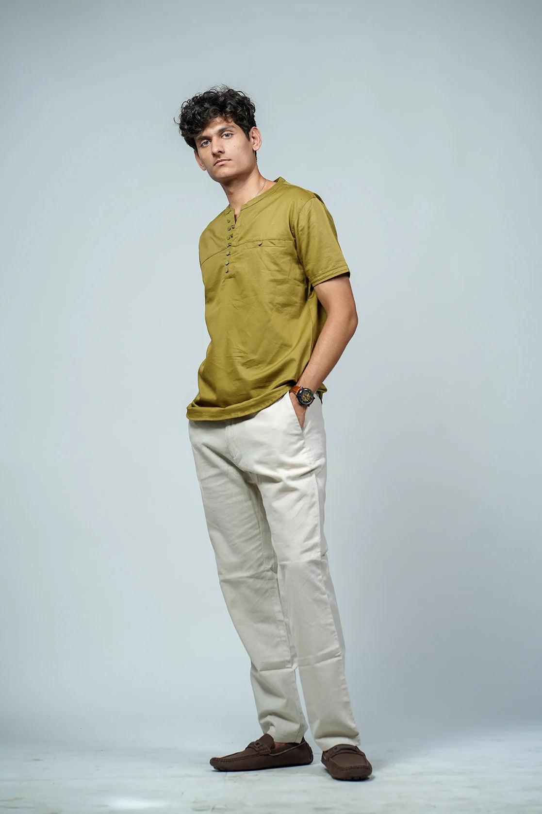 Expertly crafted for men, this Fort Collins kurta features a relaxed fit, mandarin collar, and chest pocket in an elegant olive color. Indulge in comfort and style with this versatile t-shirt kurta.