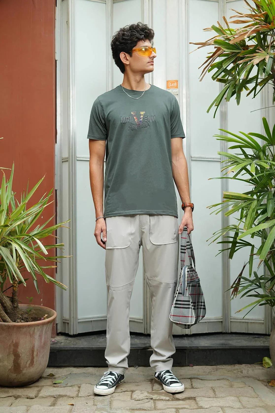 Introducing the Men's Black Round Neck Graphic Print T-Shirt with Embroidery from Fort Collins. This shirt features expertly crafted embroidery and a sleek graphic print, making it a must-have for any wardrobe.