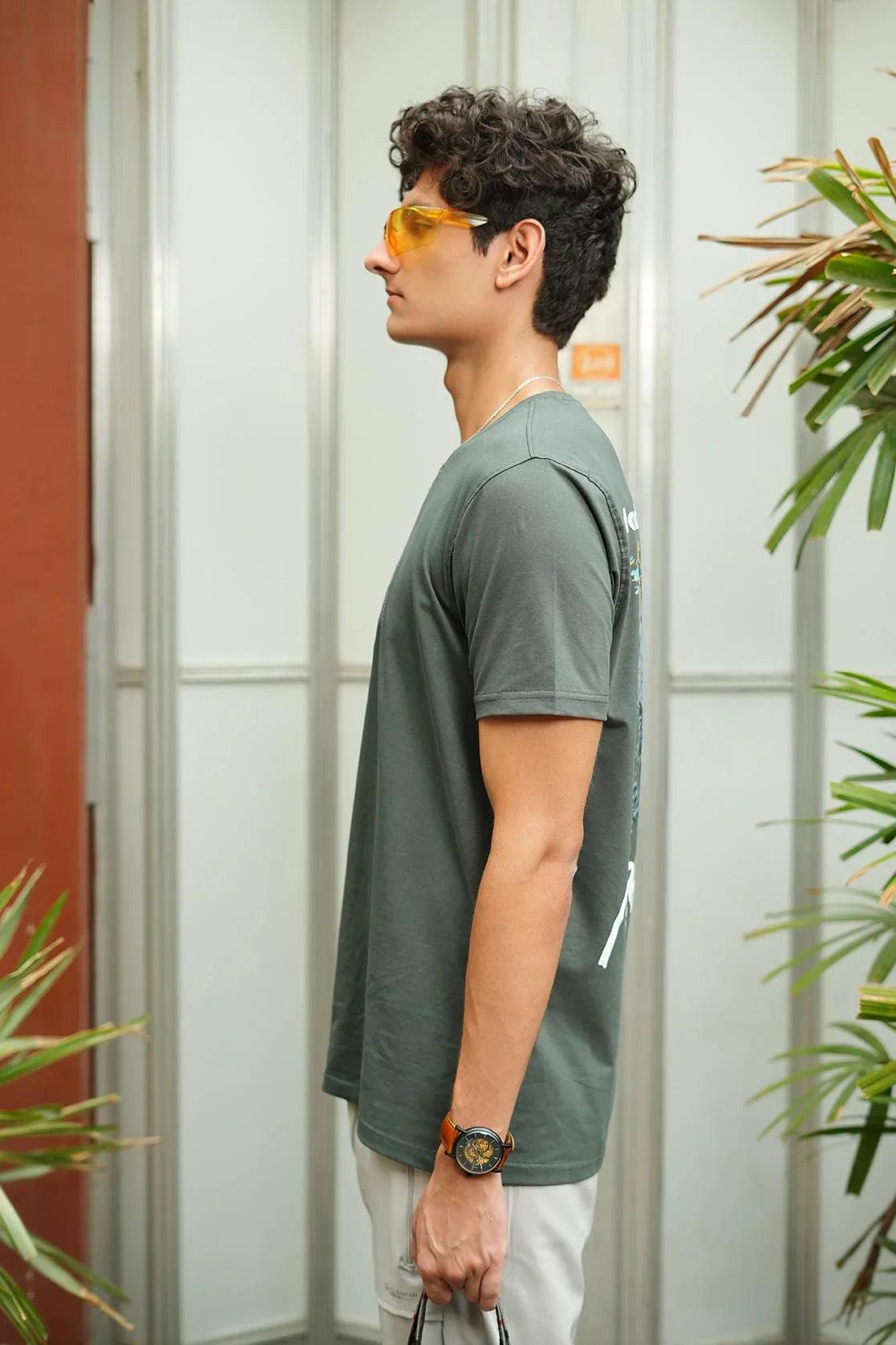 Experience the sleek style of our Men's Black Round Neck Graphic Print T-Shirt with Embroidery. This high-quality top features detailed embroidery and a modern graphic print, perfect for adding a touch of sophistication to any outfit.