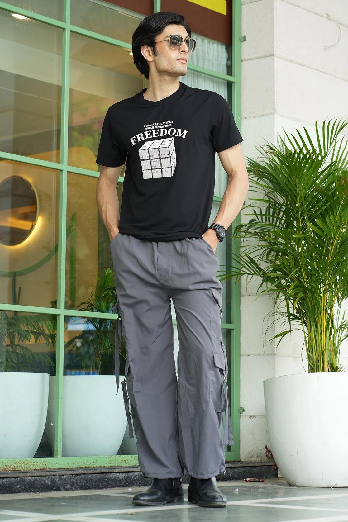 Introducing the Men's Black Stretchable T-Shirt with Embossed Freedom Graphic, perfect for those looking for a fashionable wardrobe addition. Order now for a stylish upgrade, available online from anywhere in India.