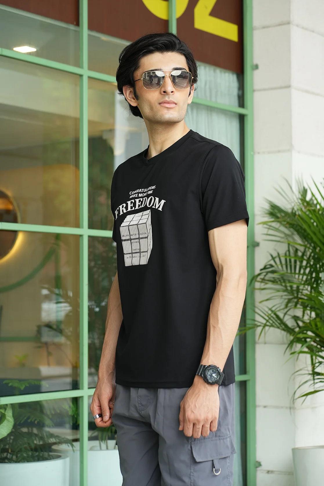 Experience ultimate comfort and style with the Fort Collins Men's Black Stretchable T-Shirt. Featuring a bold embossed Freedom graphic, this t-shirt is a must-have for any fashionable wardrobe. Shop now and elevate your fashion game from anywhere in India.