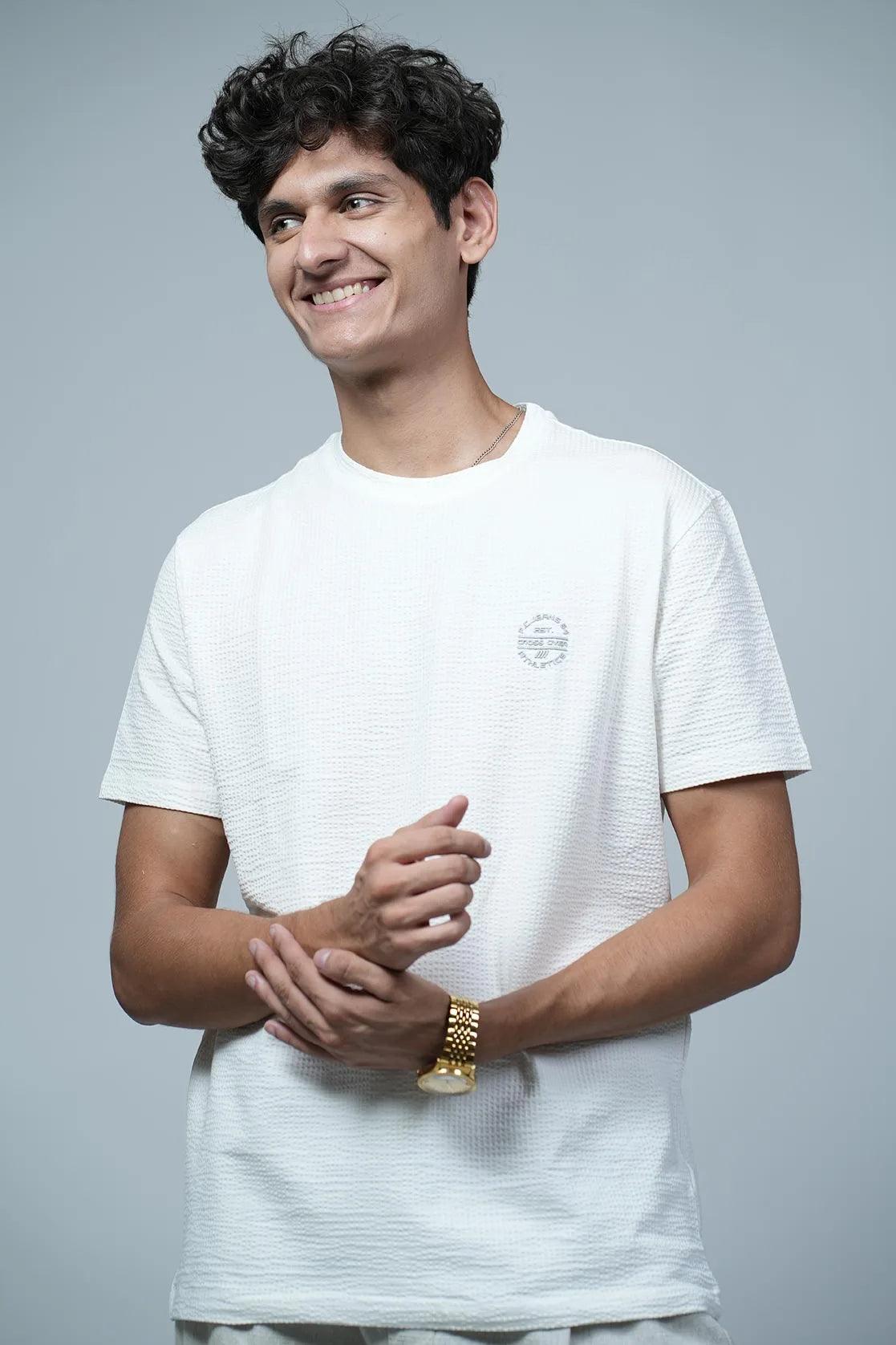 This Fort Collins men's structured fabric solid off-white round neck t-shirt features a chest logo.