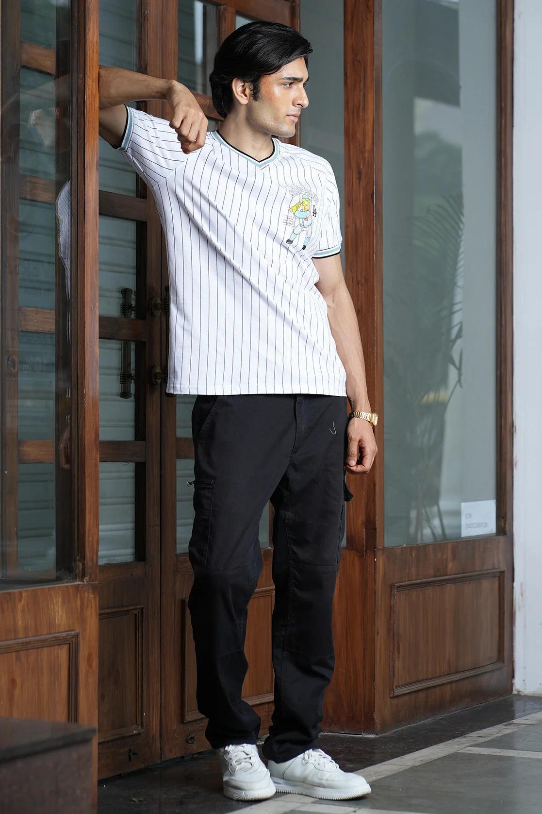 Upgrade your wardrobe with the Fort Collins Men's White with Black Pinstriped Cotton-Lycra T-shirt. This trendy item is available for online purchase from anywhere in India.
