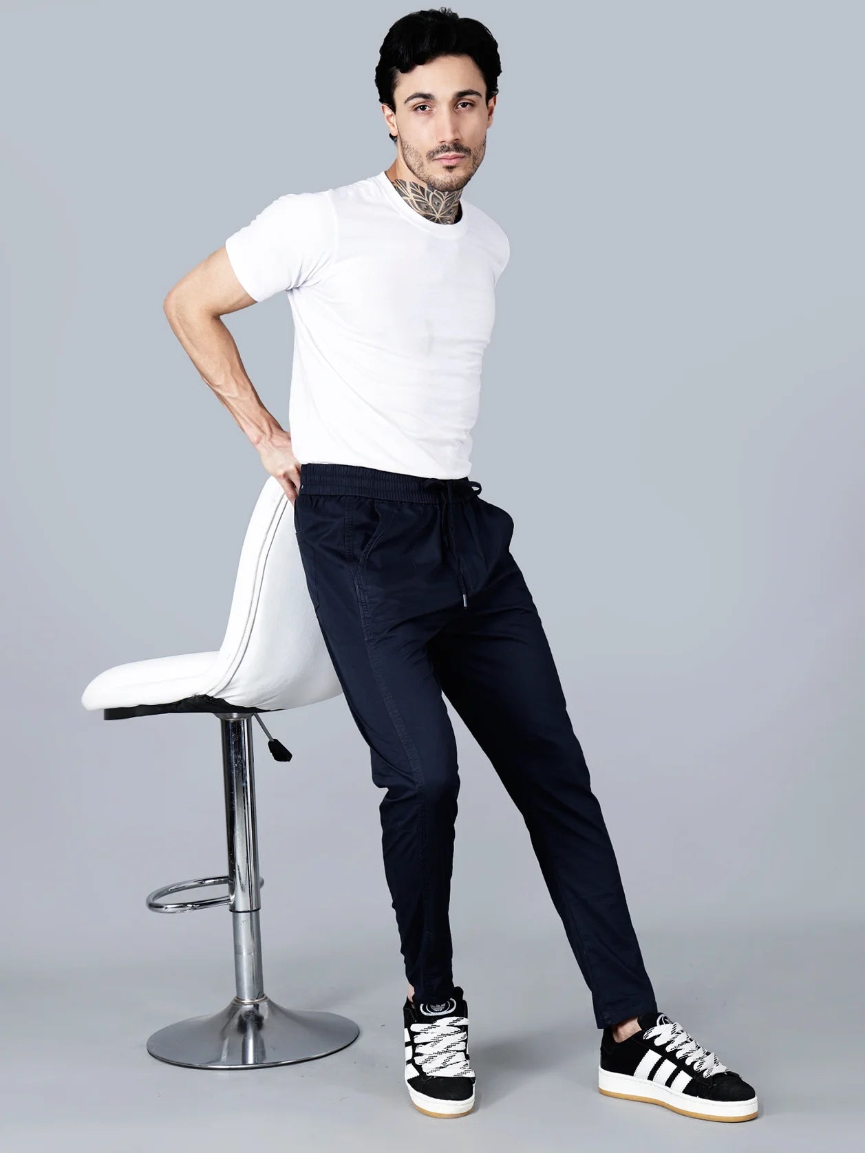 Discover the ultimate comfort and style with our Navy Cotton Track Pants for Men. Featuring a smart taper fit, elastic waistband, and multi-pocket design, these pants are perfect for any casual setting. Whether relaxing at home, traveling, or going about your daily activities, these pants will provide a breathable and fashionable option. Shop now online from anywhere in India.