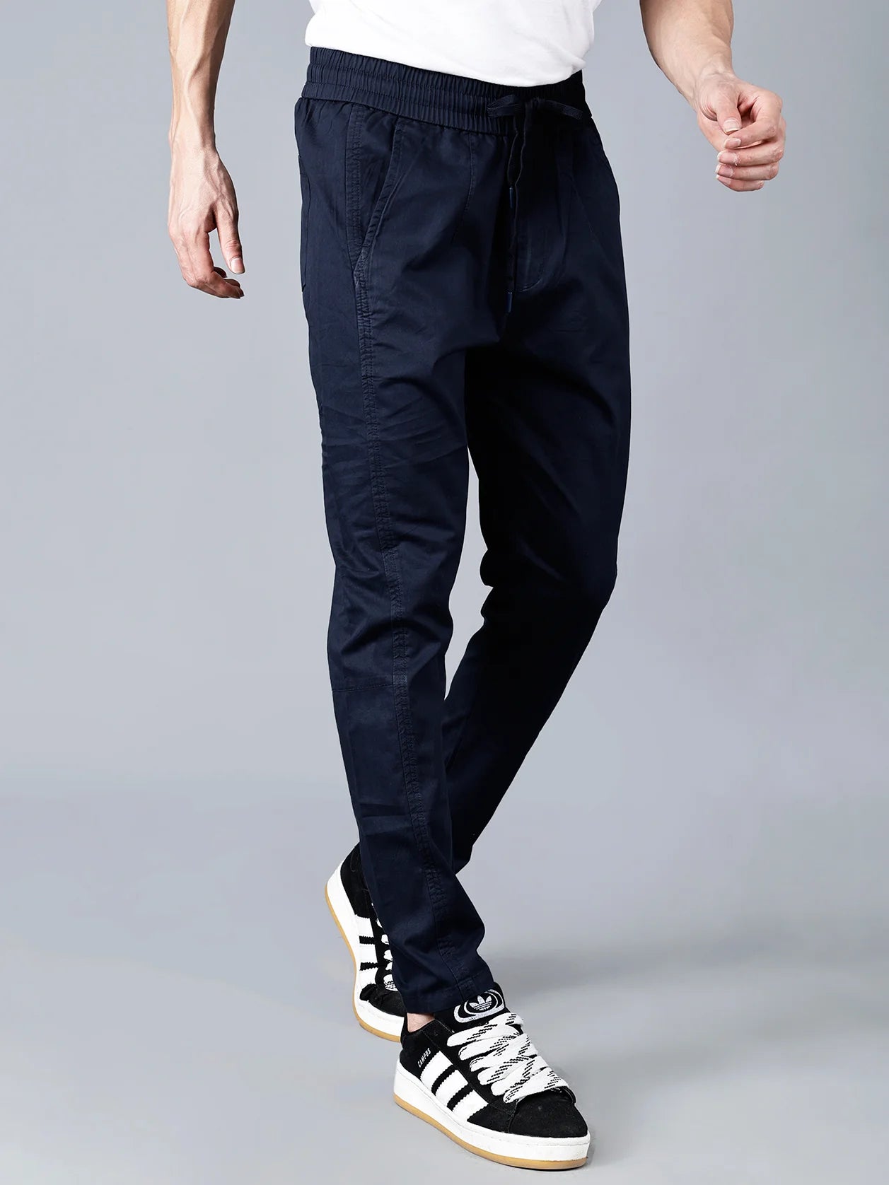 Explore online for our collection of men's navy cotton track pants from Fort Collins, featuring a tapered fit, elastic waistband, and multiple pockets for versatility and comfort. Designed for all-day wear, these pants are perfect for lounging, travel, or everyday use. Order now from anywhere in India.