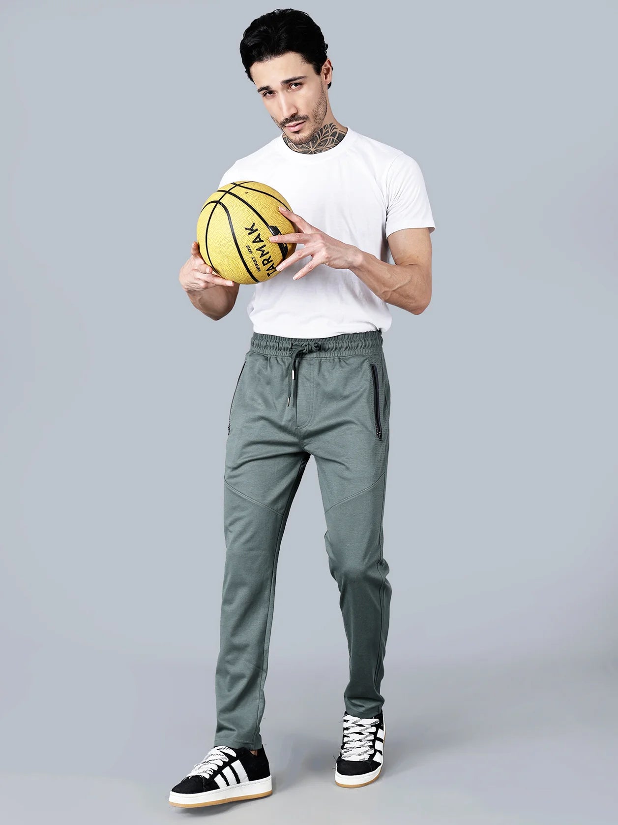 Elevate your athleisure game with our slim-fit Pista Green Track Pants for Men. These expertly crafted joggers from Fort Collins feature zipper pockets and articulated knees for added functionality. Made from a breathable cotton-poly blend, they are perfect for the gym, travel, or casual wear. Shop now from anywhere in India!