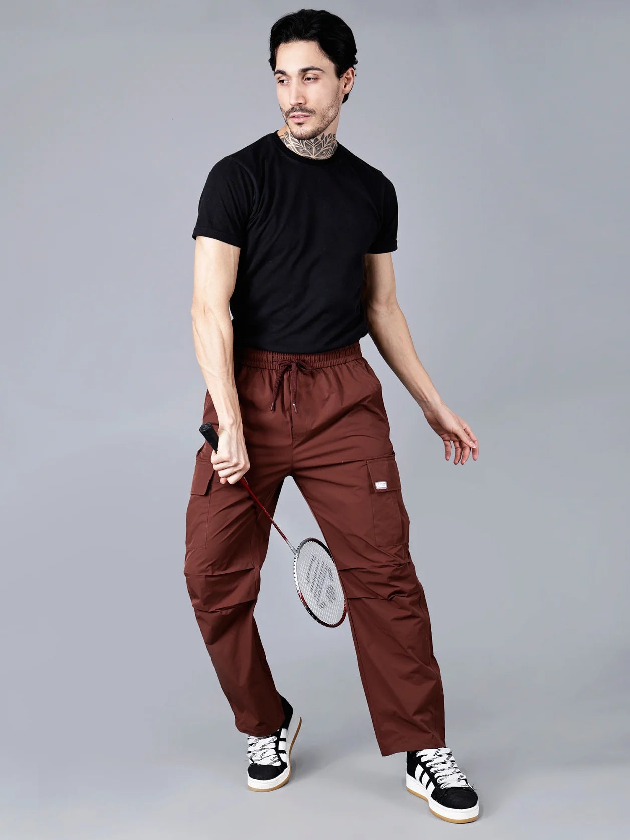 Explore the Fort Collins men's cargo track pants in wine color, designed with a relaxed fit, durable ripstop fabric and functional utility flap pockets. Perfect for sporting activities, travel or everyday wear. Available online in India with nationwide shipping.