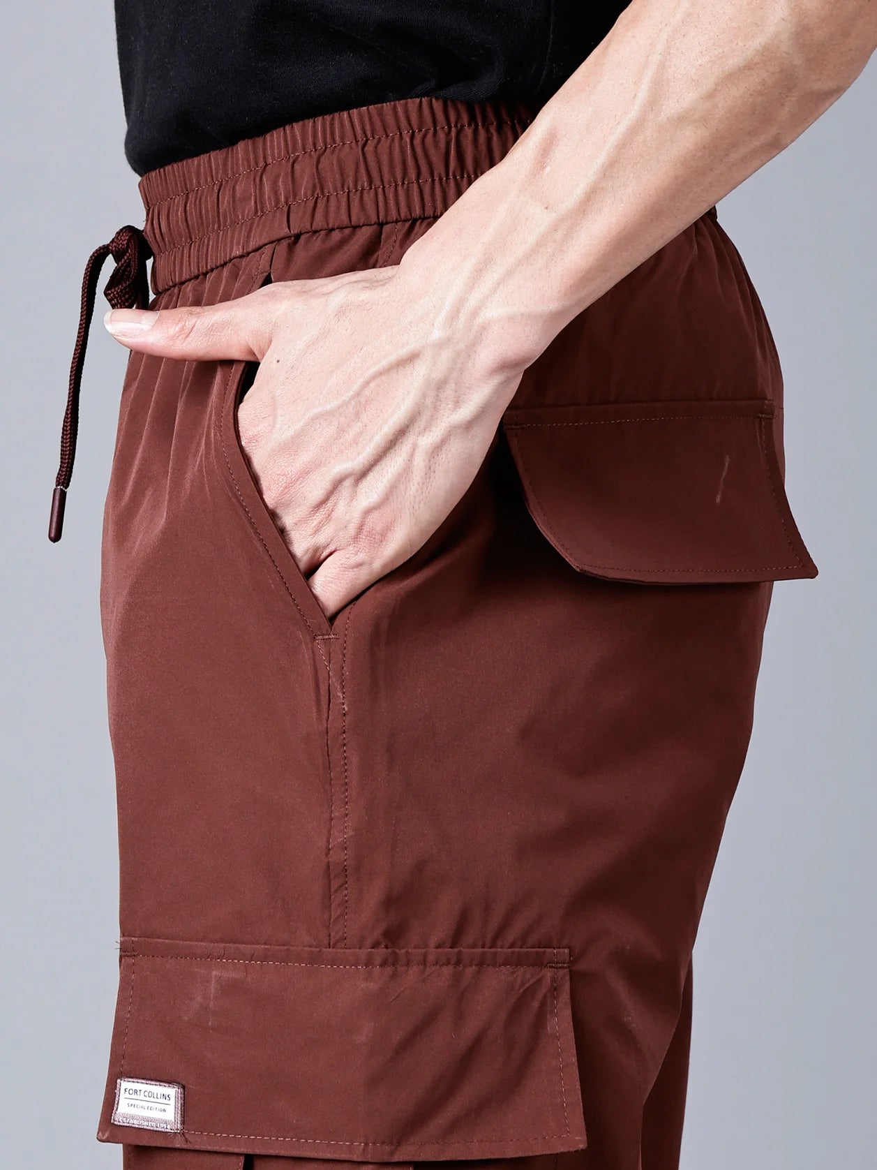 Explore the Fort Collins cargo track pants for men in wine shade, designed with utility flap pockets and durable ripstop fabric. Perfect for the gym, travel, or casual streetwear looks. Shop now on our online store and enjoy shipping across India.