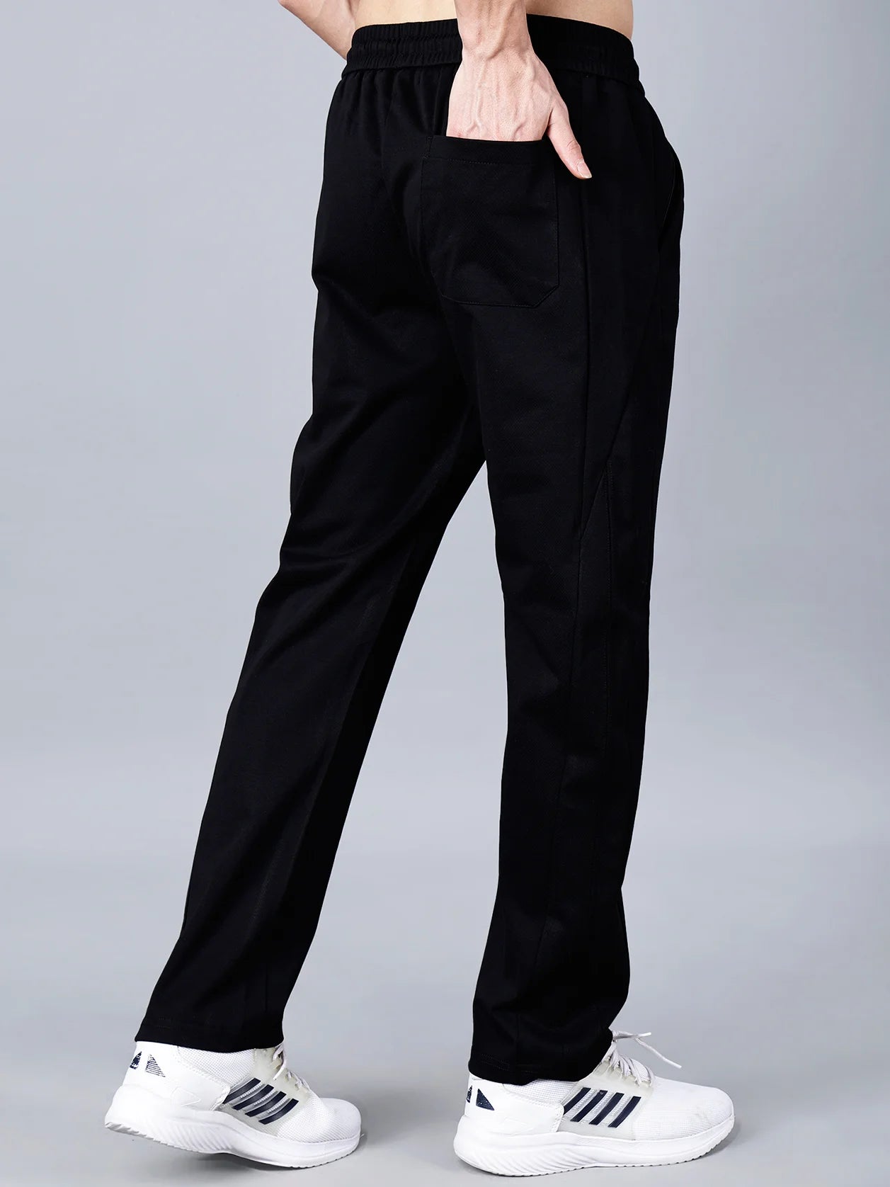 Discover the stylish comfort and practical design of Fort Collins' black cotton track pants for men, featuring a smart taper fit, elastic waistband with drawstring, and a trendy pocket design. Buy now online for this must-have trend in India.