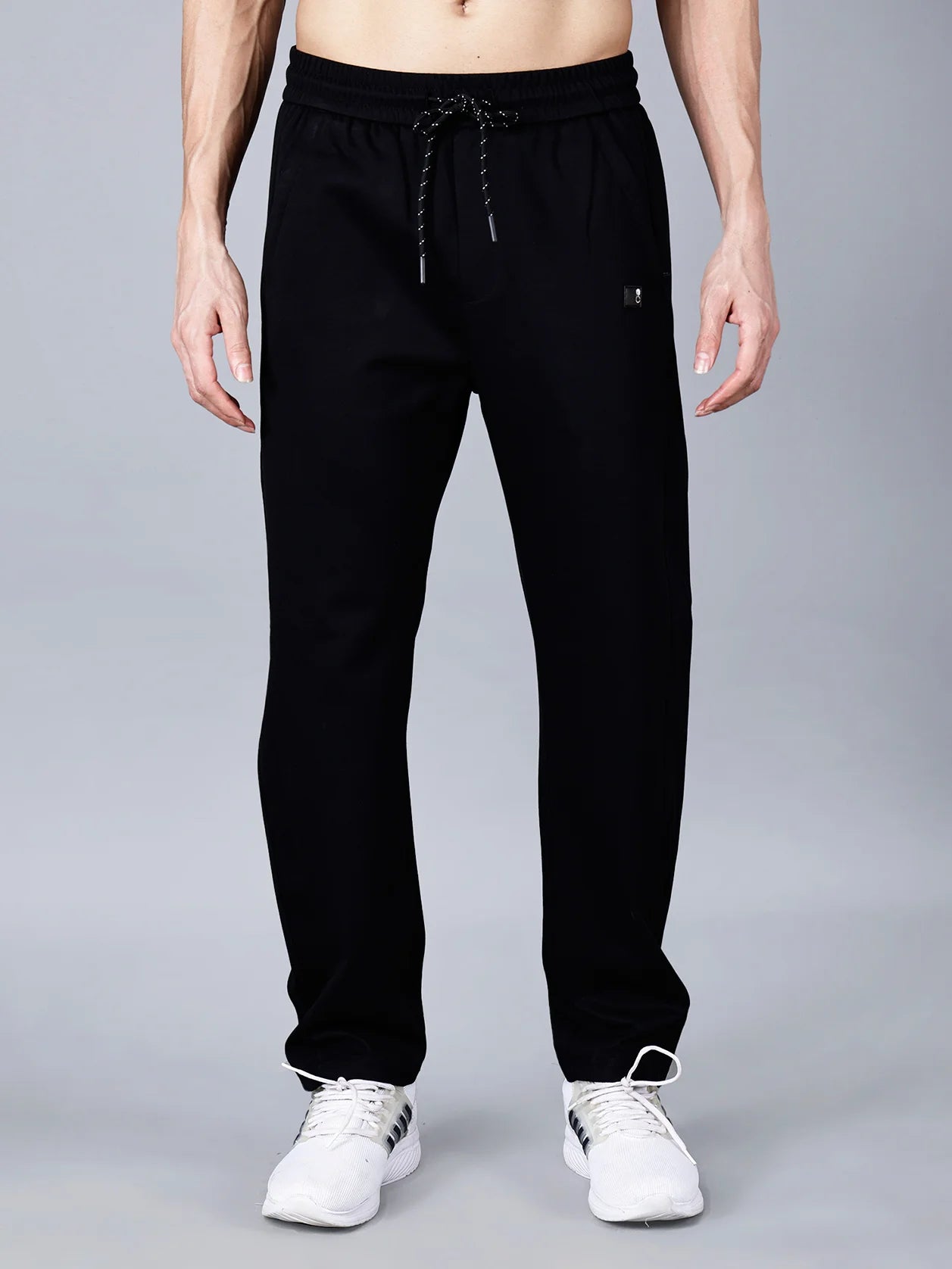 Discover the latest black cotton track pants for men by Fort Collins. Designed with a smart taper fit, elastic waistband with drawstring, and practical pocket design for stylish comfort. Buy now for the trendiest track pants online in India.