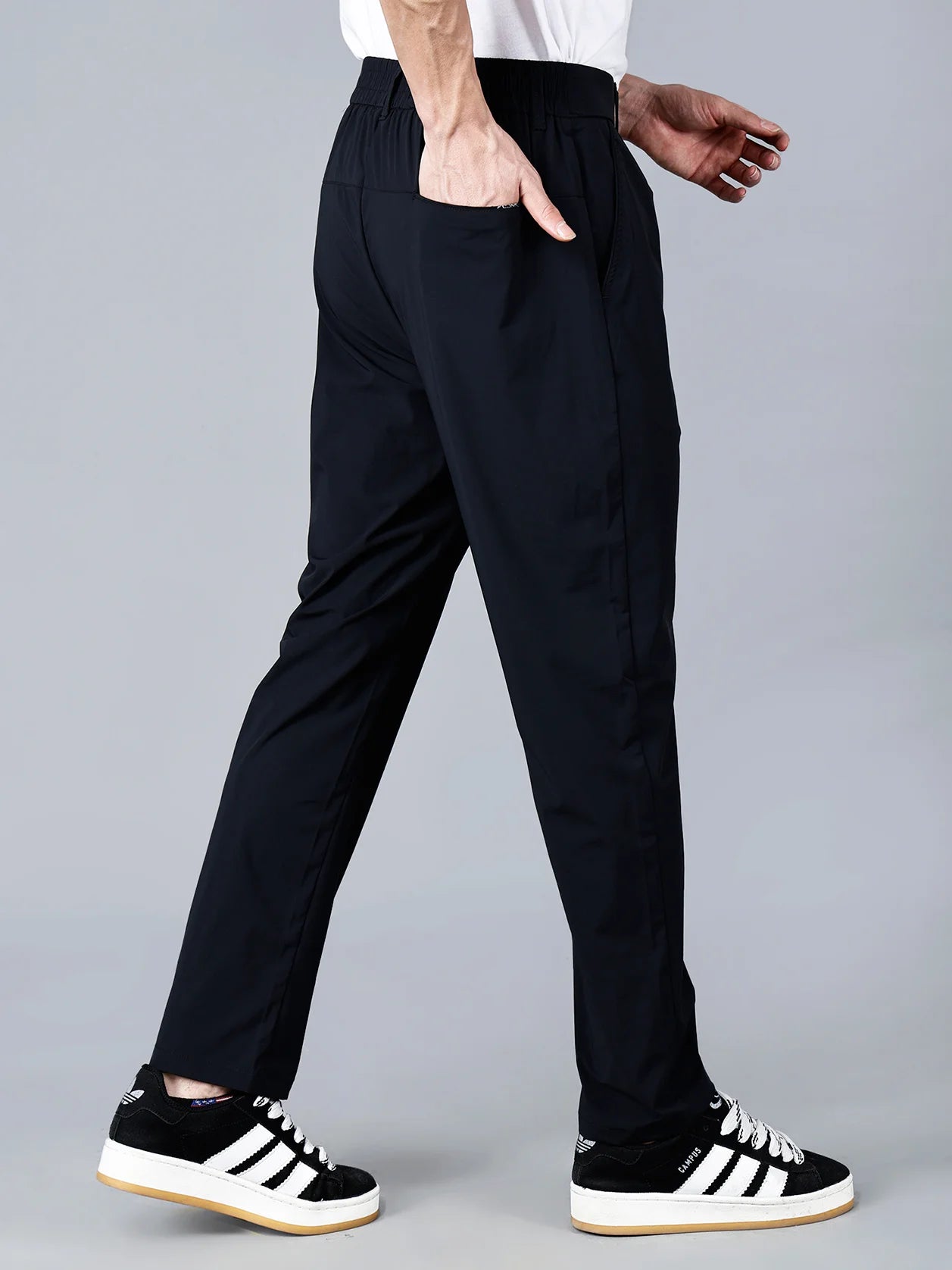 Discover the perfect balance of style and comfort with our Solid Black Slim Fit Stretchable Trouser for Men. Featuring a modern design, this trouser is made with stretchable fabric and an elastic waistband, making it perfect for your everyday wardrobe. Buy now online from anywhere in India.