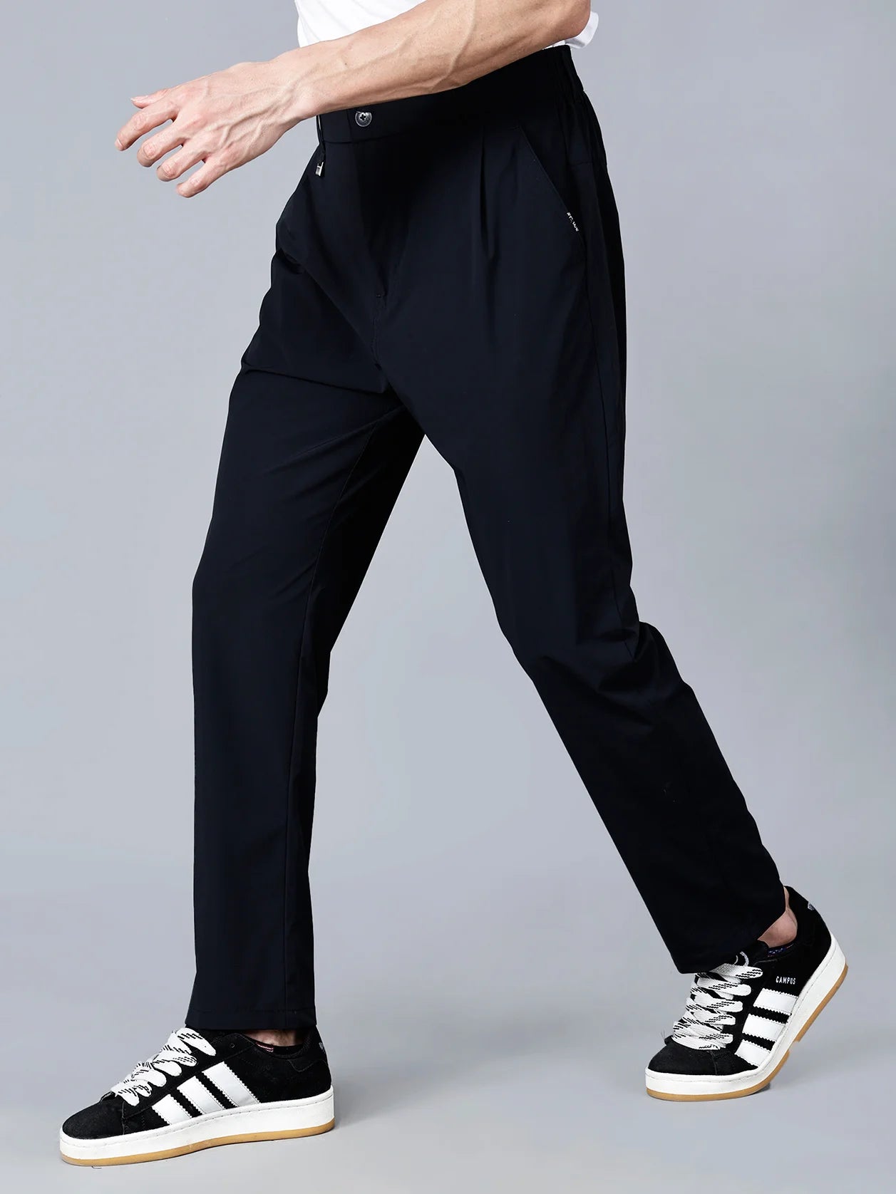 The Fort Collins Slim Fit Black Trouser for Men is constructed with stretchable fabric and an elastic waistband, making it ideal for fashionable and comfortable all-day wear. Shop now to elevate your wardrobe with this modern design, available to buy online from anywhere in India.